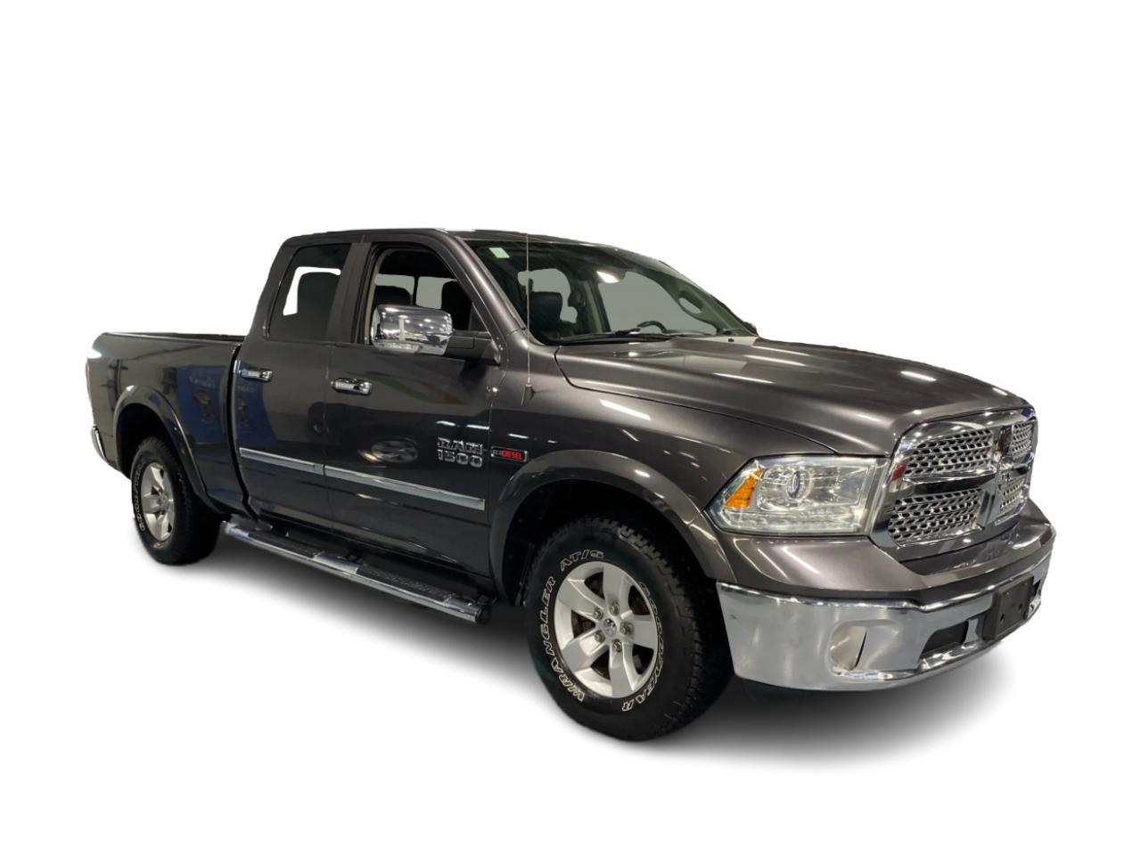 2016 RAM 1500 4WD Quad Cab 140.5" Laramie DIESEL Photo