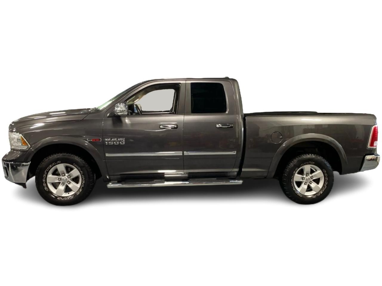 2016 RAM 1500 4WD Quad Cab 140.5" Laramie DIESEL Photo