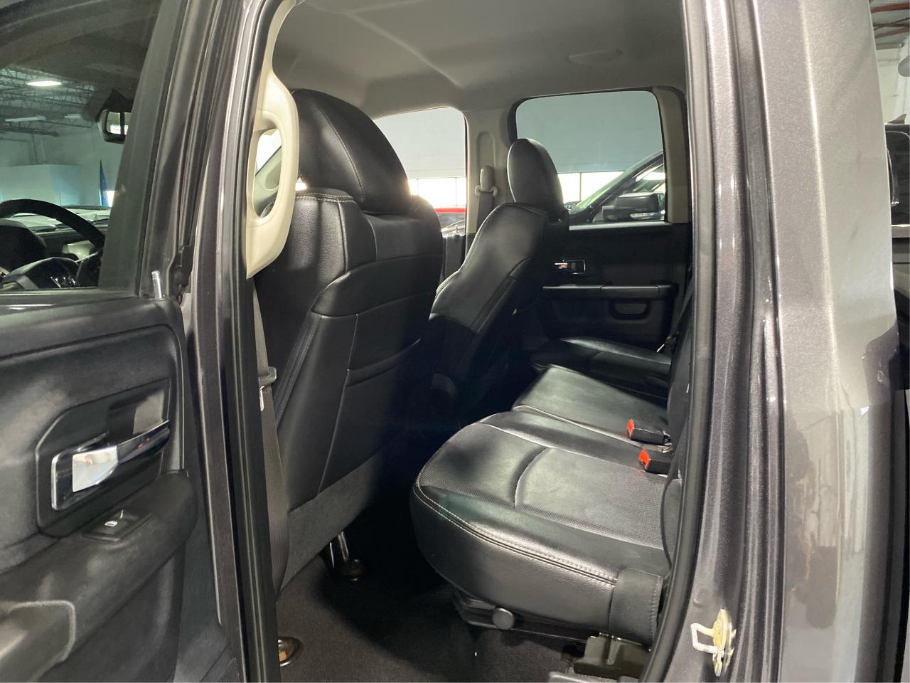 2016 RAM 1500 4WD Quad Cab 140.5" Laramie DIESEL Photo