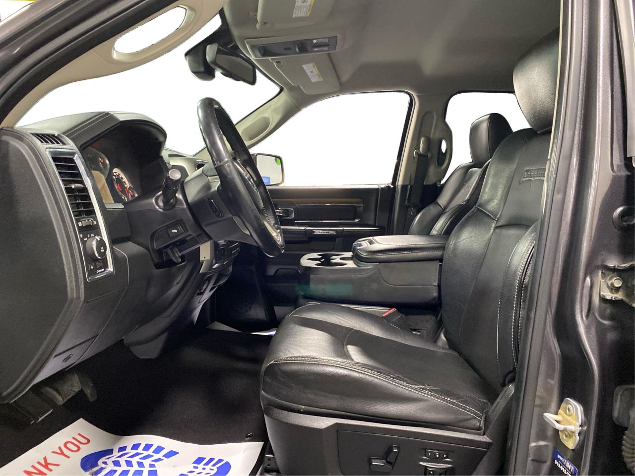 2016 RAM 1500 4WD Quad Cab 140.5" Laramie DIESEL Photo