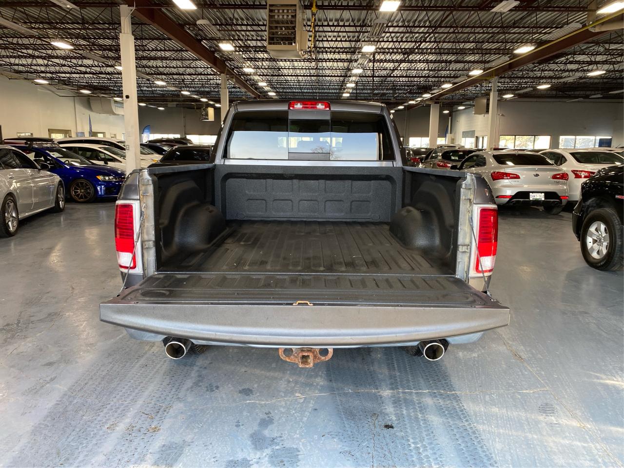 2016 RAM 1500 4WD Quad Cab 140.5" Laramie DIESEL Photo