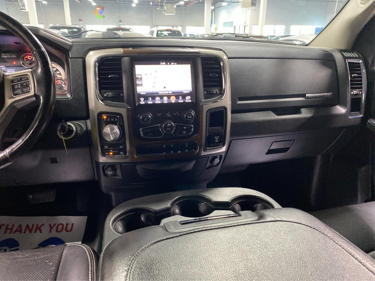 2016 RAM 1500 4WD Quad Cab 140.5" Laramie DIESEL Photo