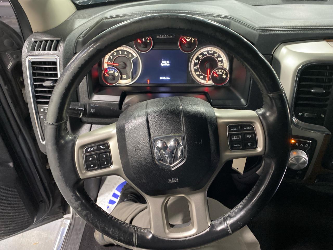 2016 RAM 1500 4WD Quad Cab 140.5" Laramie DIESEL Photo