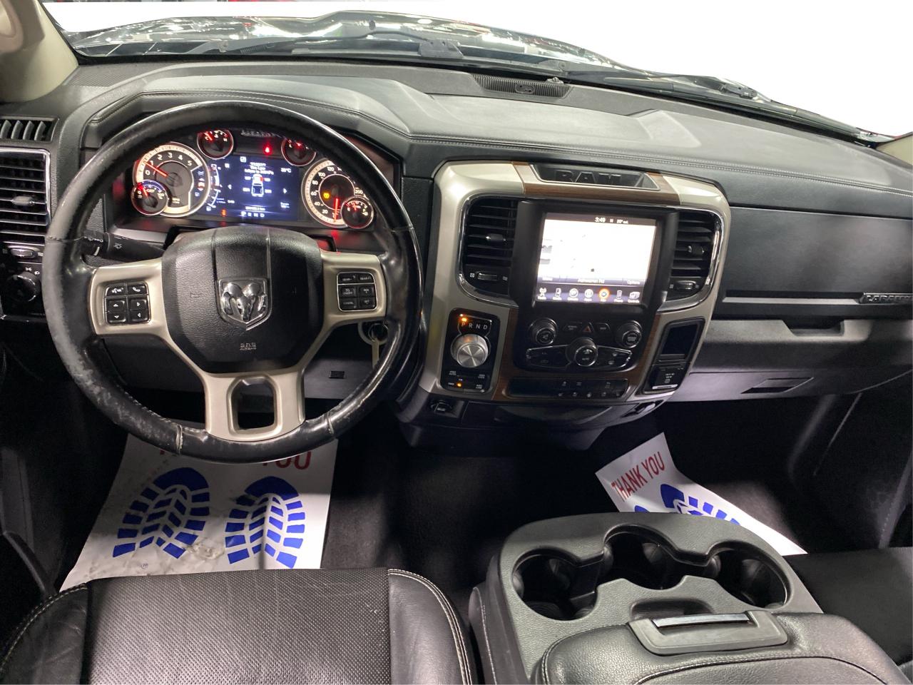 2016 RAM 1500 4WD Quad Cab 140.5" Laramie DIESEL Photo