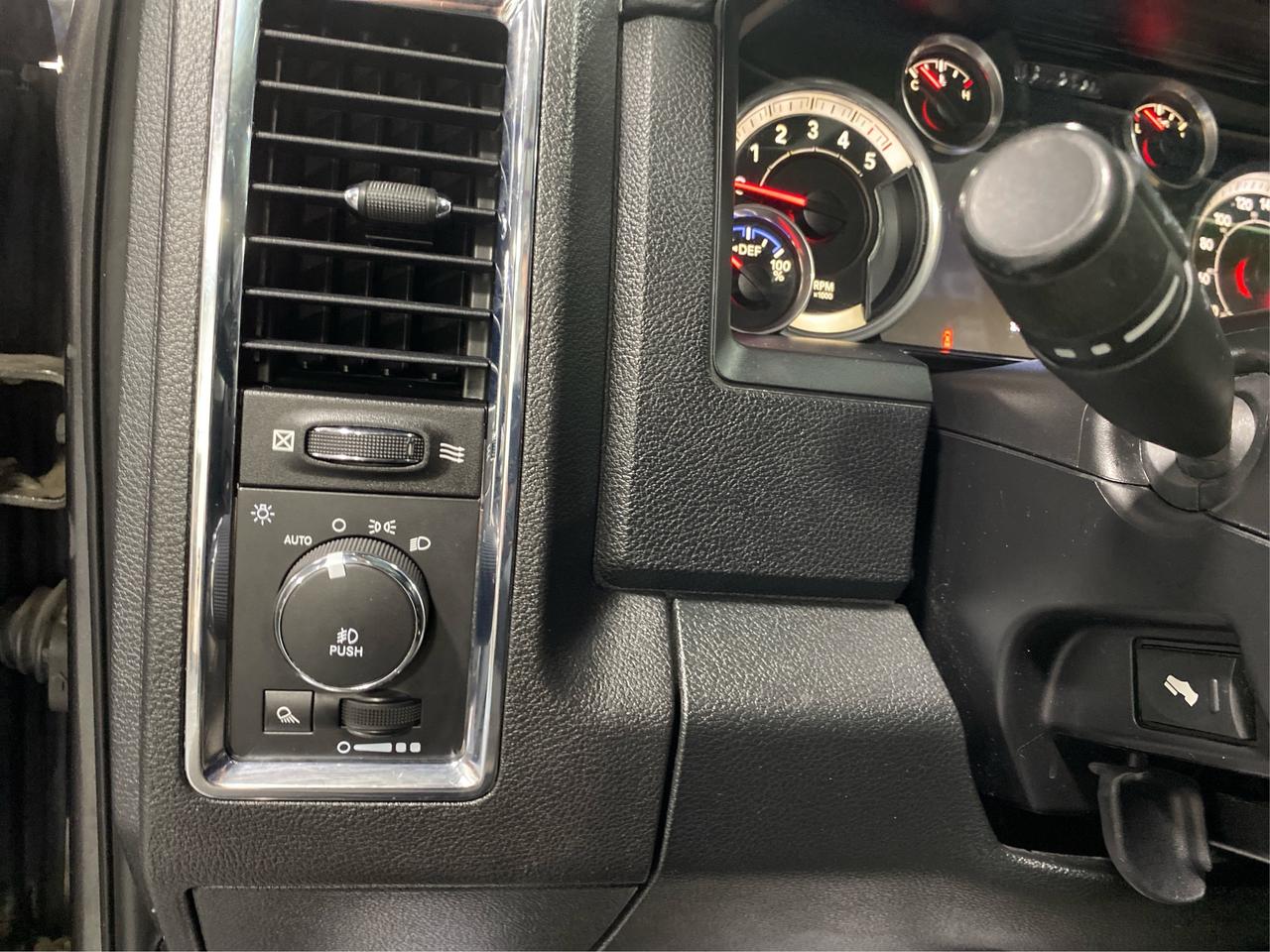 2016 RAM 1500 4WD Quad Cab 140.5" Laramie DIESEL Photo