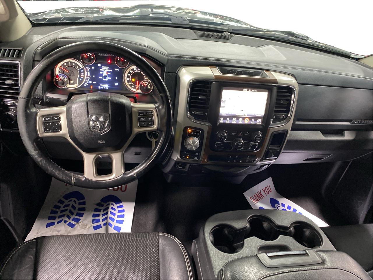 2016 RAM 1500 4WD Quad Cab 140.5" Laramie DIESEL Photo