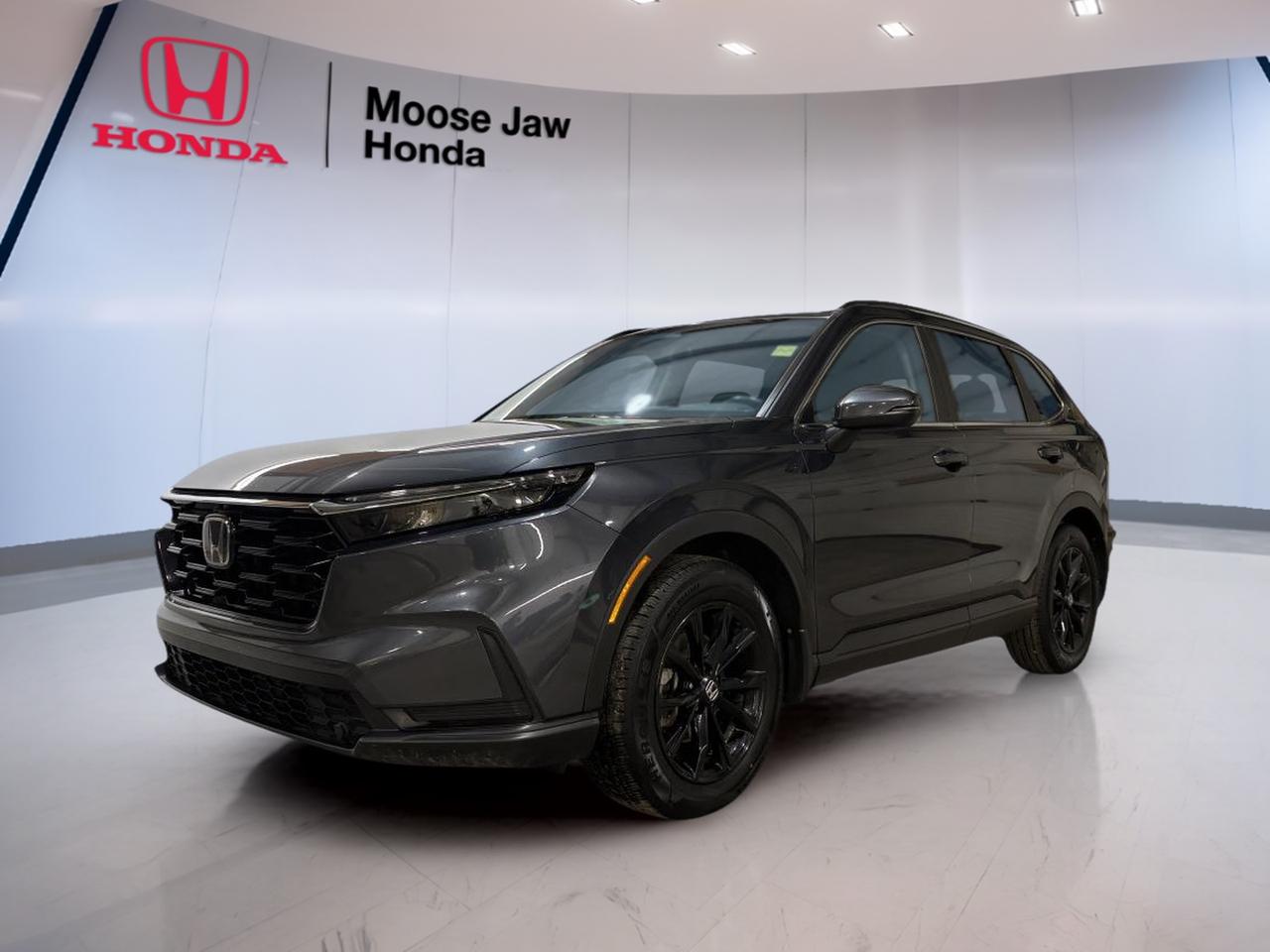 Meet a smart, confident SUV that fits life in Moose Jaw with ease. This used 2025 Honda CR-V Sport 4wd brings a clean, modern look in Grey with a Black interior, plus the everyday practicality CR-V drivers count on. With 61,054 km, it is ready for commutes, errands, and weekend plans.

Under the hood, this 2025 Honda CR-V Sport 4wd uses a 1.5 L 16-valve DOHC turbocharged 4-cylinder engine paired with a Continuously Variable Transmission. The result is smooth, steady power delivery that feels natural in town and calm on the highway. With all-wheel drive traction, you can feel more confident when roads turn slick or weather changes fast.

At Moose Jaw Honda, we know many drivers want an SUV that is easy to live with, easy to park, and easy to trust. This 2025 Honda CR-V Sport 4wd checks those boxes with a well-balanced design that supports daily comfort and practical utility. It is a great match for drivers who want one vehicle that can handle workdays and getaways.

FEATURES OF THE CR-V Sport 4wd  
»» Turbocharged 1.5 L four-cylinder engine  
»» Continuously Variable Transmission for smooth driving  
»» All-wheel drive traction for confidence  
»» Practical SUV design for daily use  

ADVANCED SAFETY FEATURES  
»» Designed for confident, controlled everyday driving  
»» Stable handling feel in changing conditions  
»» SUV visibility helps with traffic awareness  
»» Predictable power delivery supports safer merging  

PERFORMANCE AND EFFICIENCY  
»» 1.5 L turbocharged engine balances power  
»» Continuously Variable Transmission keeps acceleration smooth  
»» All-wheel drive helps in poor weather  
»» Easy highway cruising at steady speeds  

COMFORT AND CONVENIENCE  
»» SUV ride height for easier entry  
»» Cabin layout designed for daily usability  
»» Practical controls placed within easy reach  
»» Comfortable space for errands and trips  

TECHNONOLGY AND CONNECTIVITY  
»» Clear, driver-focused dash layout and controls  
»» Modern vehicle systems support daily commuting  
»» Simple interfaces help reduce driver distraction  
»» Convenient features support routine driving needs  

CARGO SPACE  
»» SUV cargo area suits weekly shopping  
»» Room for sports gear and luggage  
»» Practical rear space for everyday hauling  
»» Flexible utility for busy family schedules  

WHAT OTHER OWNERS LIKE  
»» Confident feel from all-wheel drive  
»» Smooth, easy CVT driving manners  
»» Practical size for city parking  
»» Versatile cargo space for daily life  

This 2025 Honda CR-V Sport 4wds VIN is: 2HKRS4H54SH103257.