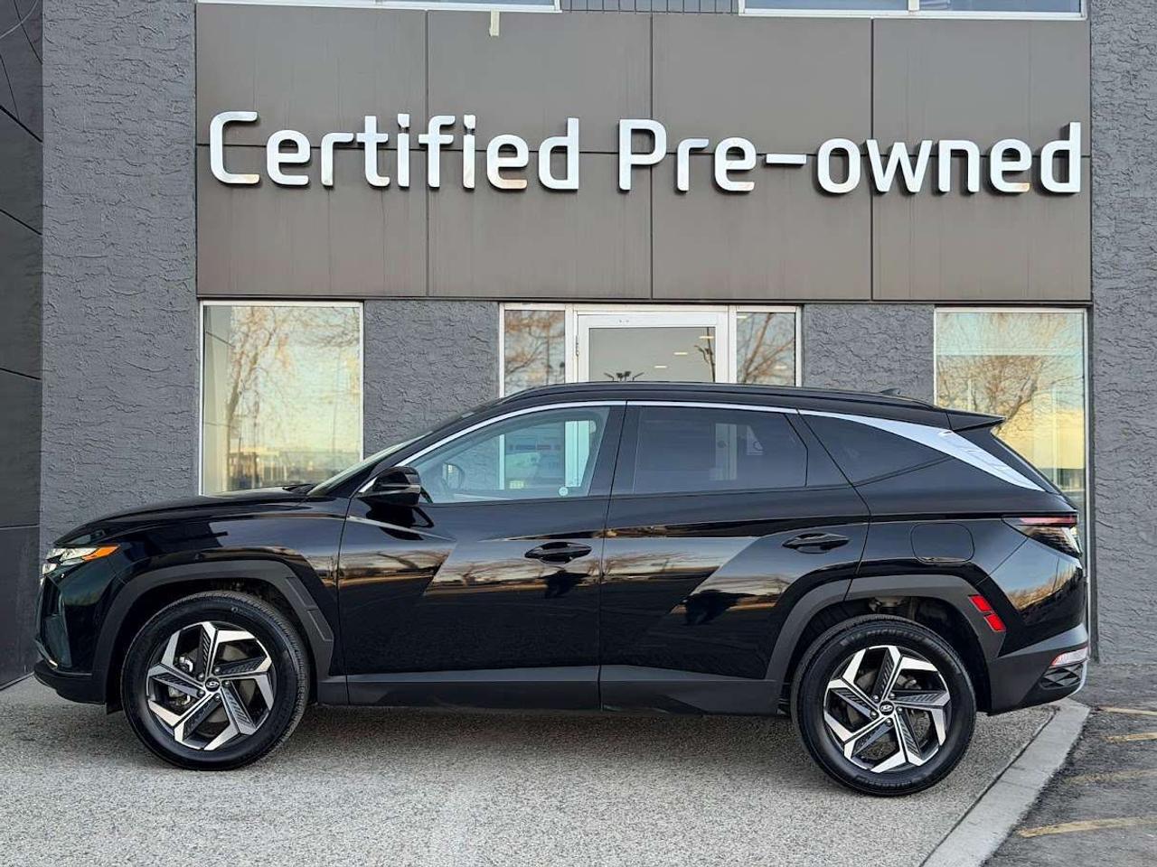 This LOW KM Hyundai Tucson HYBRID LUXURY comes loaded with a fuel efficient and responsive 1.6L TURBOCHARGED HYBRID motor, automatic transmission with selectable drive modes, an impressive HTRAC ALL WHEEL DRIVE system with multi-terrain modes, 19-inch alloy wheels, smart power liftgate, 10.25-inch full digital instrument cluster, premium 8-speker BOSE sound system, heated / cooled power leather seats, heated rear seats, park sensors, proximity key with push start ignition, heated leather wrapped steering wheel, Bluetooth phone & audio connectivity, PANORAMIC ROOF, automatic LED headlights, LED daytime running lights, Forward Collision Avoidance Assist with Emergency Braking, adaptive cruise control, Blind Spot Detection system, rear cross traffic alert, dual-zone automatic climate control, 60/40 split folding rear seats, 8-inch touchscreen with APPLE CARPLAY / ANDROID AUTO, Lane Departure Warning, High Beam Assist and much more!!!