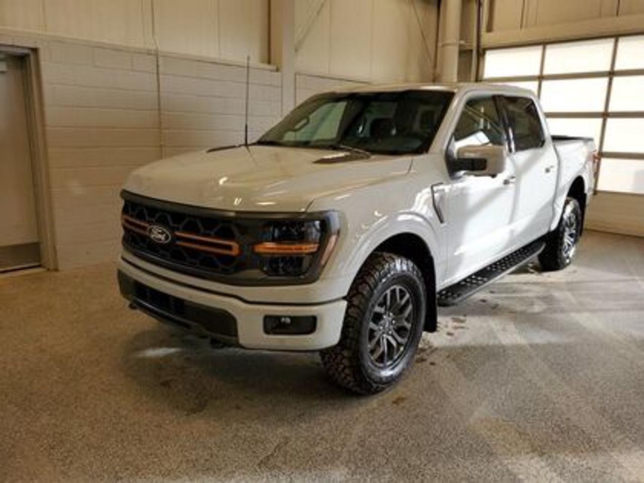 The all-new 2026 Ford F-150 Tremor 402B showcased in Avalanche. This truck is equipped with the high-performance 3.5L EcoBoost engine, producing 400 horsepower and 500 lb-ft of torque. With its 10-speed automatic transmission, also delivering a combined highway/city fuel economy of 12.9L/100km (22 miles per gallon). 

Key Features:
3.73 Electronic-locking rear-axle
Selectable Drive Modes
18 Alloy W/ Dark Matte Finish Wheels
Heated Front Seats 
Ford Co-Pilot 360 Assist 2.0
Adaptive Cruise Control
Lane Centering
Evasive Steering Assist
Front Parking Sensors
Pro Trailer Backup Assist
Pro Trailer Hitch Assist
B&O Sound System
Hill Descent Control
Remote Start System
Engine Block Heater
Twin Panel Moonroof

Moose Jaw Ford, conveniently located at 1010 North Service Road in Moose Jaw, is your trusted destination for all your automotive needs. With an impressive 4.8-star Google rating from nearly 1,500 reviews, we are proud to deliver an exceptional vehicle-buying experience tailored just for you. Our Moose Jaw Motives set us apart, offering unbeatable value like half-priced oil changes for life on pre-owned vehicles, one year of key and remote protection, and one year of tire and rim protection. Enjoy peace of mind with every purchase. At Moose Jaw Ford, were committed to driving positive change in our community by combining exceptional service, high-quality vehicles, and a guest-first approach. Visit us today!