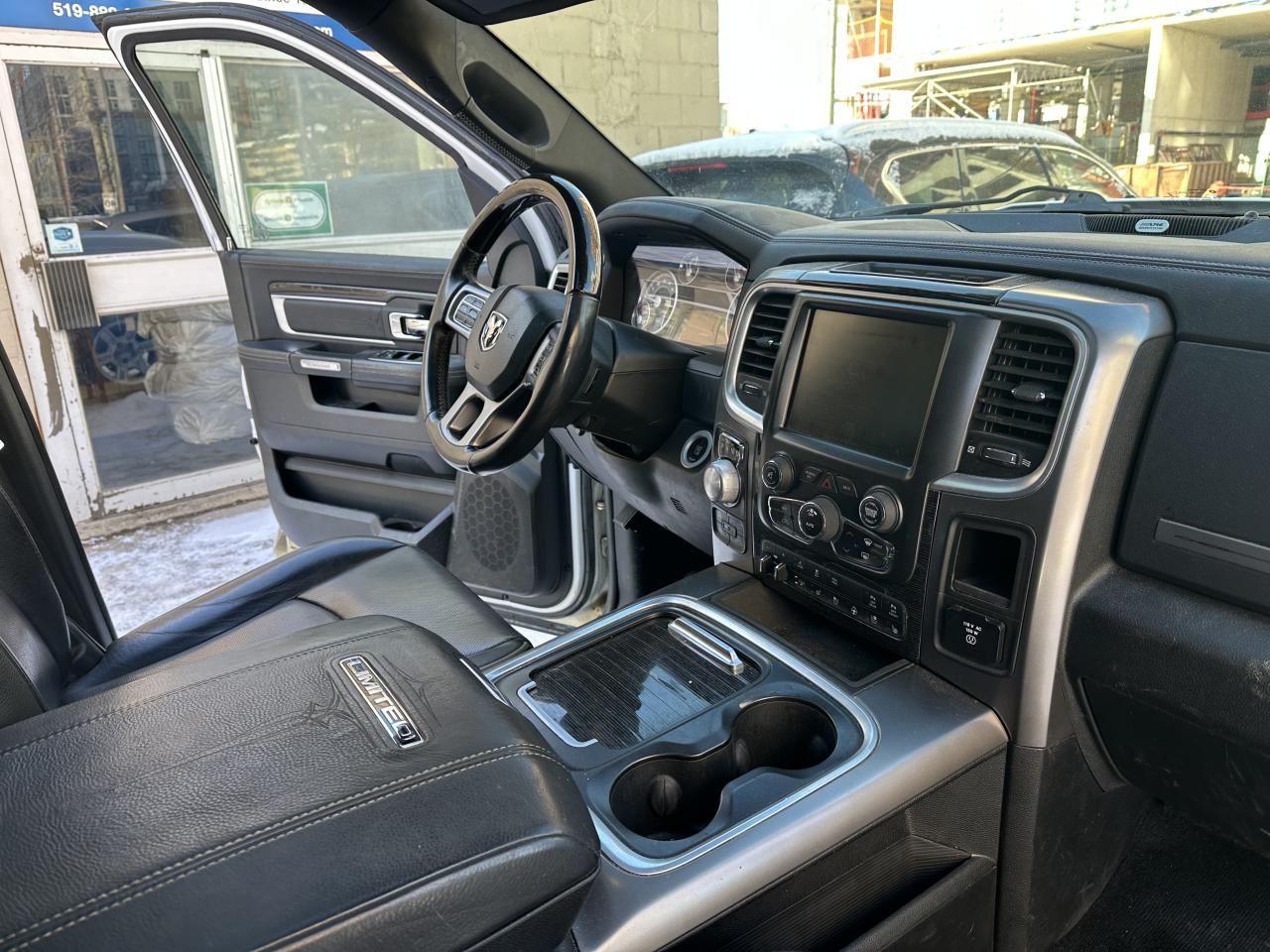 2015 RAM 1500 4WD Crew Cab 140.5" Laramie Ltd 2.0 Photo