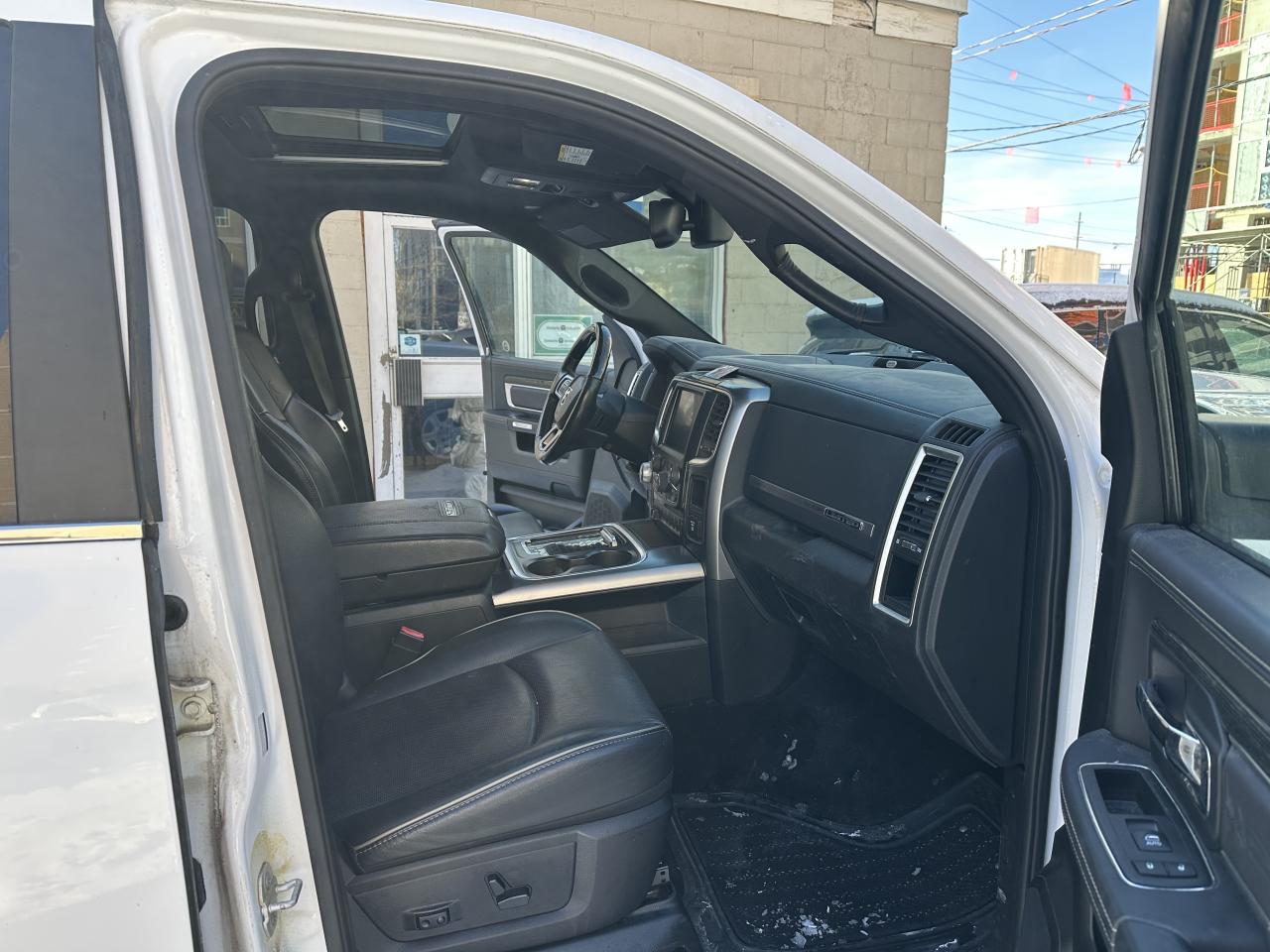 2015 RAM 1500 4WD Crew Cab 140.5" Laramie Ltd 2.0 Photo