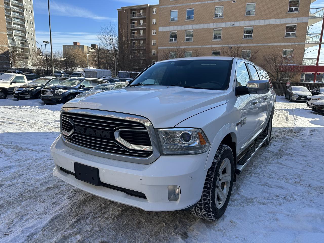2015 RAM 1500 4WD Crew Cab 140.5" Laramie Ltd 2.0 Photo
