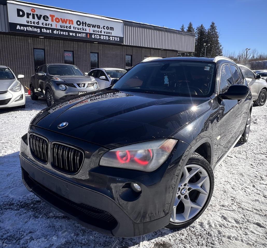 <p>2012 BMW X1 &ndash; SPORTY, LUXURIOUS & FUN TO DRIVE!</p><div>LIKE NEW &ndash; LEGENDARY BMW ENGINEERING, DYNAMIC HANDLING & PREMIUM COMFORT!<br>2.0L TURBO I4 ENGINE + AUTOMATIC TRANSMISSION &ndash; RESPONSIVE, SMOOTH & BUILT FOR PERFORMANCE!<br>WELL-EQUIPPED WITH PREMIUM FEATURES: LEATHER SEATS, PANORAMIC SUNROOF, BACKUP SENSORS, BLUETOOTH, MULTI-FUNCTION STEERING WHEEL, POWER WINDOWS & LOCKS, KEYLESS ENTRY!<br>PERFECT FOR COMMUTERS, SMALL FAMILIES OR CITY DRIVING &ndash; COMPACT, SPORTY & PRACTICAL WITH BMW LUXURY FEEL!<br>EASY FINANCING AVAILABLE!<br><br>ADVERTISED PRICE IS OUR FINANCE PRICE<br><br>DRIVETOWNOTTAWA.COM &ndash; COME VISIT US / VENEZ NOUS VISITER!<br>TAXES AND LICENSING EXTRA. SEE DRIVETOWNOTTAWA.COM FOR CASH PRICE FINANCING CHARGES APPLY (BANK FEES, PPSA, INTEREST). QUEBEC SAFETY FEE APPLICABLE.</div>