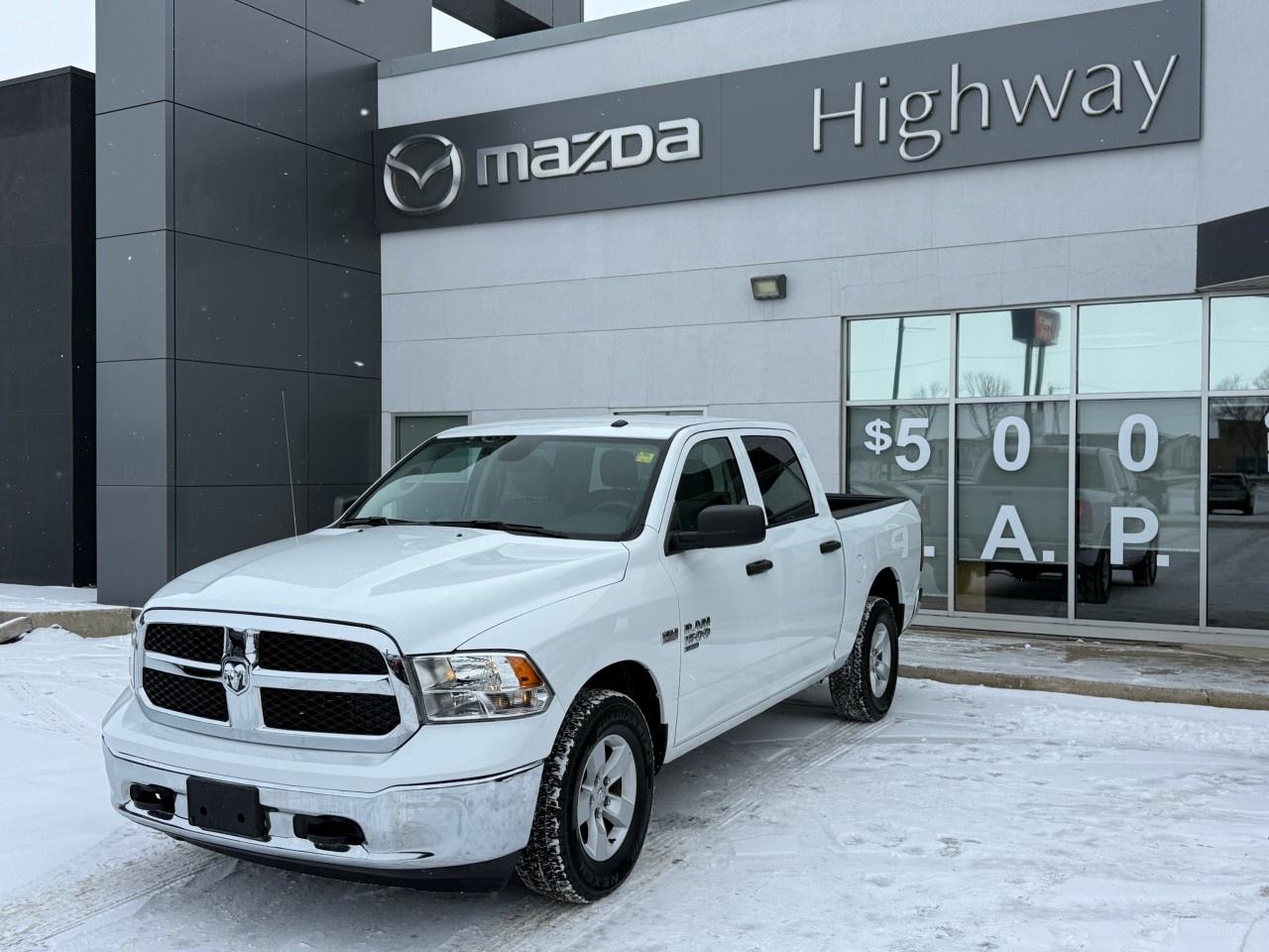 HEMI POWER!! This 2023 Ram 1500 Classic SLT Crew Cab 4x4 balances rugged capability with everyday comfort, featuring a spacious six-passenger interior and a reliable 5.7L HEMI V8 engine. This well-appointed SLT trim steps up the convenience with remote keyless entry and the Uconnect infotainment system with hands-free communication to keep you connected on the job or the trail. Come by Highway Mazda today!