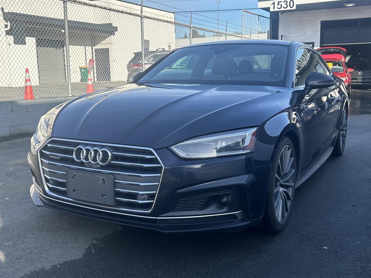 <p>Please check out our website <a href=https://milani.biz/>https://milani.biz/ </a>for Carfax information.</p><p class=my-2 [&+p]:mt-4 [&_strong:has(+br)]:inline-block [&_strong:has(+br)]:pb-2>🚗 Come check out what’s new at&nbsp;<strong>Milani Auto Sales!</strong><br>Proudly serving Burnaby for over 30 years.</p><p class=my-2 [&+p]:mt-4 [&_strong:has(+br)]:inline-block [&_strong:has(+br)]:pb-2><strong>We buy, sell, and trade</strong> clean cars and trucks — with&nbsp;<strong>financing and leasing options (OAC)</strong>&nbsp;and <strong>easy&nbsp;bi-weekly payments</strong>!</p><p class=my-2 [&+p]:mt-4 [&_strong:has(+br)]:inline-block [&_strong:has(+br)]:pb-2>✅ Independent vehicle inspection complete<br>✅ Vehicle history report included</p><p>Local Vehicle with No Accidents. Bonus Fully dealer documented serviced since new. You will not find a Cleaner one :Experience the thrill of the road with this stunning 2018 Audi A5 Technik, available now at Milani Auto Sales! This sleek coupe is the epitome of sporty sophistication, boasting a powerful yet efficient 4-cylinder engine and the confidence-inspiring grip of all-wheel drive. Whether youre navigating city streets or cruising along the open highway, the A5 Technik delivers a driving experience that is both exhilarating and refined. Its automatic transmission ensures seamless gear changes, allowing you to fully enjoy the drive.</p><p>Prepare to be captivated by the A5s striking design and premium features. This two-door coupe offers a blend of performance and luxury, guaranteed to turn heads wherever you go. The Audi A5 Technik provides a comfortable and connected driving experience. Dont miss the opportunity to own this exceptional vehicle. Visit Milani Auto Sales today and discover why the 2018 Audi A5 Technik is the perfect choice for the discerning driver.</p><p>Here are five standout features of this 2018 Audi A5 Technik:</p><ul><li><strong>Iconic Audi Design:</strong> Experience the timeless elegance of Audis signature coupe styling, guaranteed to make a statement.</li><li><strong>Quattro All-Wheel Drive:</strong> Conquer any road condition with confidence and control, thanks to Audis legendary all-wheel-drive system.</li><li><strong>Precision Engineering:</strong> Enjoy the perfect blend of performance and efficiency with a responsive 4-cylinder engine.</li><li><strong>Automatic Transmission:</strong> Effortlessly glide through gears with the smooth and intuitive automatic transmission.</li><li><strong>Sporty Coupe Design:</strong> This two-door coupe offers a thrilling driving experience combined with premium luxury.</li></ul><p><strong><em>Powered by AutoIntelligence™</em></strong> Vehicle information has been generated using artificial intelligence and is provided for informational purposes only. While efforts are made to ensure accuracy, please confirm all details directly with the dealer.</p><p>Find your next ride today!</p>