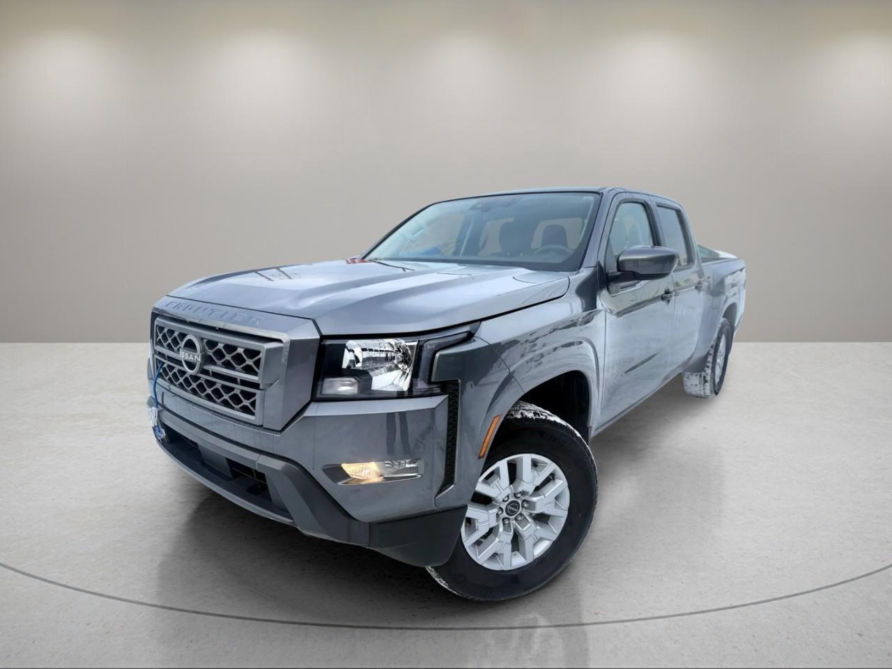 <p>The 2024 Nissan Frontier SV Crew Cab 4x4 Long Bed in elegant Gray promises unmatched driving performance and capability thanks to its 4x4 drivetrain and robust handling. Whether you're navigating city streets or rugged terrain, this truck is ready for any adventure.</p><p>Designed to impress, its striking exterior features modern styling complemented by sleek alloy wheels, while inside, the stylish Black interior offers comfort and advanced features. Step into a cabin filled with cutting-edge options tailored for your convenience, including remote start, keyless entry, and power windows.</p><p>Technological enhancements are at your fingertips with the smart device integration and user-friendly interfaces like the backup camera and satellite radio. Safety is paramount, with features like adaptive cruise control, lane assist, and parking sensors, letting you drive with peace of mind.</p><p>Perfect for thrill-seekers and families who value performance and safety, the 2024 Nissan Frontier SV Crew Cab is sure to exceed your expectations. Contact us today to learn more and experience this remarkable vehicle firsthand.</p>