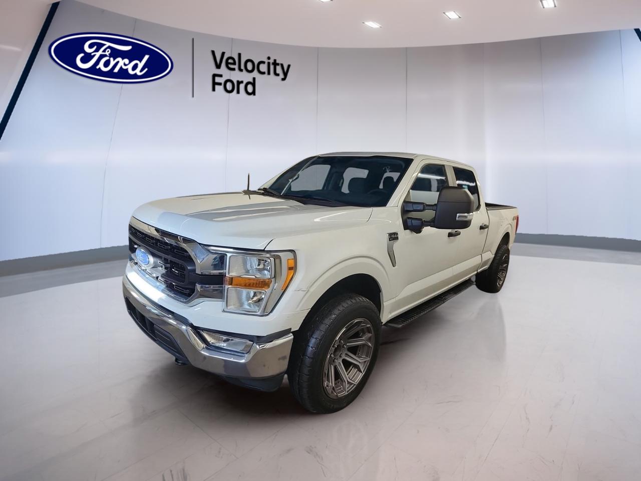 Built for real work and everyday comfort, this used 2022 Ford F-150 XLT SuperCrew 6.5 Box at Velocity Ford in Moose Jaw delivers the power and confidence truck owners want. With a 5.0 L gas V8, automatic transmission, and 4WD, its ready for Saskatchewan roads year-round. Finished in white with a dark grey interior, it shows 51,456 km and is set up to tow up to 4,671 kg.

The 2022 Ford F-150 XLT SuperCrew 6.5 Box gives you a full-size crew cab with 4 doors, making it easy to bring the crew, the family, or both. The long 6.5 ft box adds useful cargo length for jobsite gear, weekend projects, and everything in between. This truck also includes off-road tires and rear tow hooks, so its prepared when the pavement ends.

TRUCK FEATURES  
»» Towing capacity rated at 4,671 kg  
»» Four-wheel drive for tough conditions  
»» Rear tow hook for recovery help  
»» 6.5 ft box for longer cargo  

ADVANCED SAFETY FEATURES  
»» Anti-lock braking system for controlled stops  
»» Stability control helps maintain traction  
»» Side impact airbags for added protection  
»» Lane departure warning for extra awareness  

PERFORMANCE AND EFFICIENCY  
»» 5.0 L gas V8 power  
»» Automatic transmission with dual shift mode  
»» Power steering for easy low-speed control  
»» Tire pressure monitoring helps prevent issues  

COMFORT AND CONVENIENCE  
»» Front air conditioning for cabin comfort  
»» Cruise control for relaxed highway drives  
»» Power windows for quick adjustments  
»» Driver lumbar support for longer trips  

TECHNONOLGY AND CONNECTIVITY  
»» Navigation system for confident routing  
»» Bluetooth integration for hands-free calling  
»» WiFi hotspot helps keep devices connected  
»» Steering wheel audio controls within reach  

CARGO SPACE  
»» SuperCrew cabin offers flexible interior space  
»» Rear trunk access for easier loading  
»» Spare tire onboard for roadside readiness  
»» Tinted windows help protect interior items  

WHAT OTHER OWNERS LIKE  
»» Strong V8 feel and smooth power  
»» Confident 4WD traction in winter  
»» Useful driver-assist alerts for daily commuting  
»» Practical cabin space for passengers  

This 2022 Ford F-150 XLT SuperCrew 6.5 Boxs VIN is: 1FTFW1E52NFA75208.