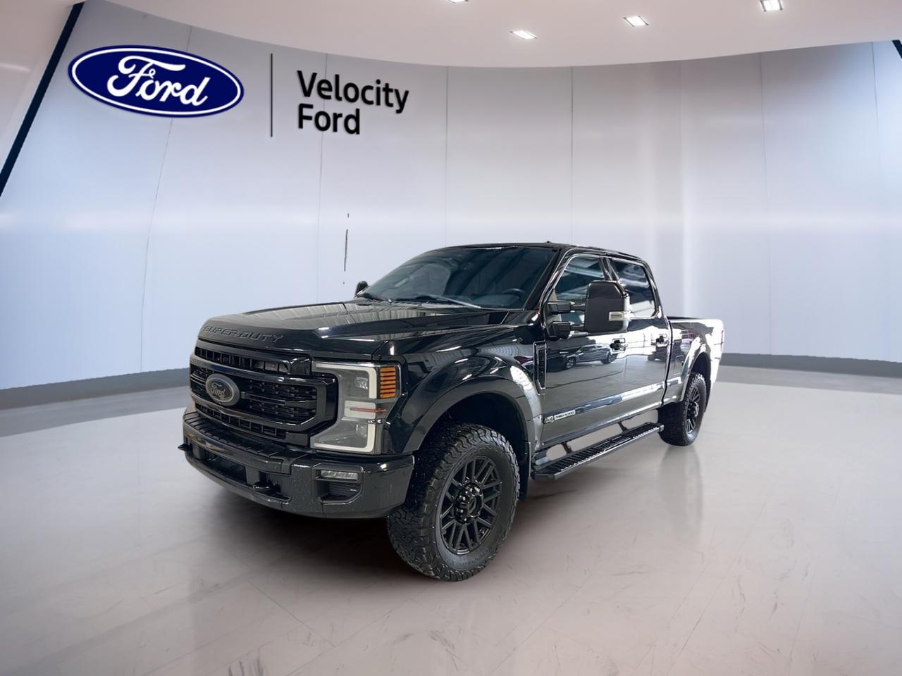 Meet the used 2022 Ford Super Duty F-250 SRW LARIAT Crew Cab at Velocity Ford in Moose Jaw, built for serious work and confident everyday driving. With a bold Black exterior, Black interior, and 4 full-size doors, this truck brings a strong presence and real capability. It has 152,894 km and an automatic transmission.

Under the hood is a 6.7 L gas engine paired with Four-Wheel Drive (4WD) for dependable traction when roads turn rough or job sites get muddy. This Super Duty F-250 SRW LARIAT Crew Cab is also rated to tow up to 6,576 kg, giving you the muscle to handle trailers, equipment, and weekend toys with confidence.

TRUCK FEATURES  
»» Towing capacity rated at 6,576 kg  
»» Four-Wheel Drive for tough conditions  
»» Limited slip differential for improved traction  
»» Rear tow hook for recovery support  

ADVANCED SAFETY FEATURES  
»» Anti-Lock Braking System for controlled stops  
»» Stability Control helps maintain road grip  
»» Blind Spot Monitor for safer lane changes  
»» Side impact airbags for added protection  

PERFORMANCE AND EFFICIENCY  
»» 6.7 L gas engine for strong pull  
»» Automatic transmission for smooth power delivery  
»» Dual shift mode for driver control  
»» Power steering for easier low-speed maneuvers  

COMFORT AND CONVENIENCE  
»» Dual-zone automatic climate control comfort  
»» Heated front seats for cold mornings  
»» Memory seat settings for quick setup  
»» Power windows and automatic door locks  

TECHNONOLGY AND CONNECTIVITY  
»» Navigation system for confident route planning  
»» Bluetooth integration for hands-free calling  
»» WiFi hotspot helps keep you connected  
»» Satellite radio and HD Radio included  

CARGO SPACE  
»» Crew Cab seating with rear access  
»» Rear trunk access for added utility  
»» Steps help with easier cab entry  
»» Spare tire onboard for backup support  

WHAT OTHER OWNERS LIKE  
»» Confident towing and hauling capability  
»» Strong 4WD traction in winter  
»» Helpful driver aids like blind spot  
»» Comfortable cabin for long drives  

This 2022 Ford Super Duty F-250 SRW LARIAT Crew Cabs VIN is: 1FT7W2BT0NEF37865.