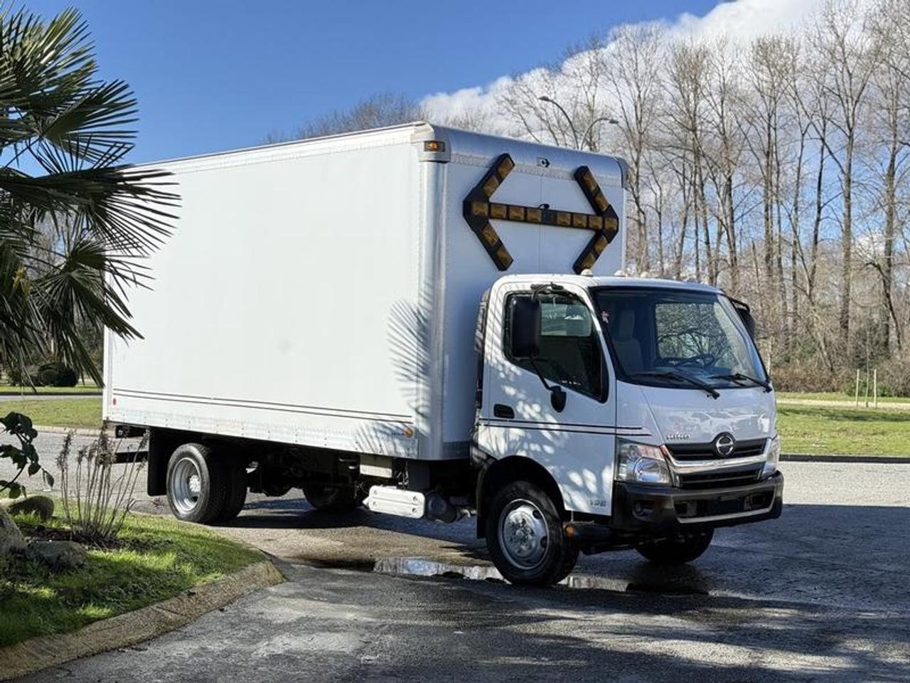This 2014 Hino 195 cube van is powered by a 5.1L inline-4 diesel paired with an automatic transmission and rear-wheel drive, and features a 16-foot cargo box suitable for delivery or service applications. It is equipped with a Whelen traffic advisor, trailer hitch, trailer brake controller, and fast idle function, along with cruise control, air conditioning, AM/FM radio, power windows, and power mirrors. Finished in white with a grey cloth interior, this truck offers a straightforward and practical setup for commercial or fleet use. This item is currently OFFSITE. You must register an appointment with our office to schedule an offsite viewing. Appointments must be made a minimum of one business day in advance (and as defined by the days that Repo.com is open for business) before your appointment can be scheduled and confirmed. We may, at our own discretion, instead opt to transport smaller items to Repo.coms main yard for viewing purposes.  $46,820.00 plus $375 processing fee, $47,195.00 total payment obligation before taxes.   Listing report, warranty, contract commitment cancellation fee, financing available on approved credit (some limitations and exceptions may apply). All above specifications and information is considered to be accurate but is not guaranteed and no opinion or advice is given as to whether this item should be purchased. We do not allow test drives due to theft, fraud, acts of vandalism and undetectable impaired driving. Instead we provide the following benefits: Complimentary Warranty (with options to extend), Limited Money Back Satisfaction Guarantee on Fully Completed Contracts, Contract Commitment Cancellation, and an Open-Ended Sell-Back Option. Ask seller for details or call 604-522-REPO(7376) to confirm listing availability.