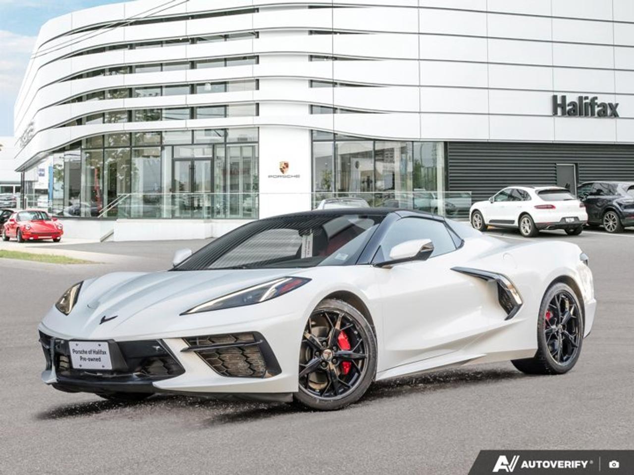 *Now available at Porsche of Halifax*, this *2021 Chevrolet Corvette Stingray Convertible* finished in *Arctic White* with a *Adrenaline Red interior* delivers exotic-level performance with everyday usability. Powered by a *naturally aspirated 6.2L V8 *and paired with an *8-speed dual-clutch transmission*, this *C-8 Corvette* offers thrilling acceleration, sharp handling, and unmistakable presence.*Steele Auto Inspected Unit. 85 Point Mechanical Inspection completed by a Red-Seal technician. This car required 4 Brand New Tires, Fresh 2 Year Motor Vehicle Inspection, and Fresh Oil and Filter Change. **Beat the crowd on this one and be ready for Spring!*==== Performance & Power ====  *   *6.2L V8 Direct Injection engine*  *   *490 horsepower (with standard exhaust)*  *   *8-speed dual-clutch automatic transmission*  *   *0--100 km/h in approximately 3.0 seconds*  *   *Mechanical limited-slip differential*  *   *Driver Mode Selector* with multiple performance settings  *   *Front Lift Adjustable Height System with memory*==== Convertible & Exterior Highlights ====  *   *Power retractable body-colour hardtop* with remote activation  *   *Carbon Flash exterior accents and badge package*  *   *Carbon Flash painted nacelles and roof edge*  *   *19 front / 20 rear Trident black-painted aluminum wheels*  *   *Red-painted brake calipers*  *   *LED headlamps and daytime running lamps*  *   *Power heated outside mirrors* with turn indicators==== Interior & Comfort ====  *   *GT2 Bucket Seats*  *   *8-way power seats*  *   *Dual-zone automatic climate control*  *   *Leather-wrapped steering wheel*  *   *Rear Camera Mirror*  *   *Power tilt and telescopic steering column*  *   *Keyless open and start*  *   *Remote vehicle start*==== Technology & Connectivity ====  *   *Chevrolet Infotainment 3 Plus with 8 HD touchscreen*  *   *Wireless Apple CarPlay® & Wireless Android Auto?*  *   *BOSE® Premium 10-speaker audio system*  *   *12 digital Driver Information Center*  *   *HD Rear Vision Camera with Rear Park Assist*  *   *Teen Driver Mode*----------------------------------------The *2021 Corvette Stingray Convertible* represents a true leap forward in American performance --- combining mid-engine balance, supercar-level acceleration, and open-air excitement. Finished in timeless Arctic White over Adrenaline Red, and equipped with desirable performance and comfort options, this example stands out as a beautifully specified sports car.*Now at Porsche of Halifax* --- contact us today to schedule your private viewing