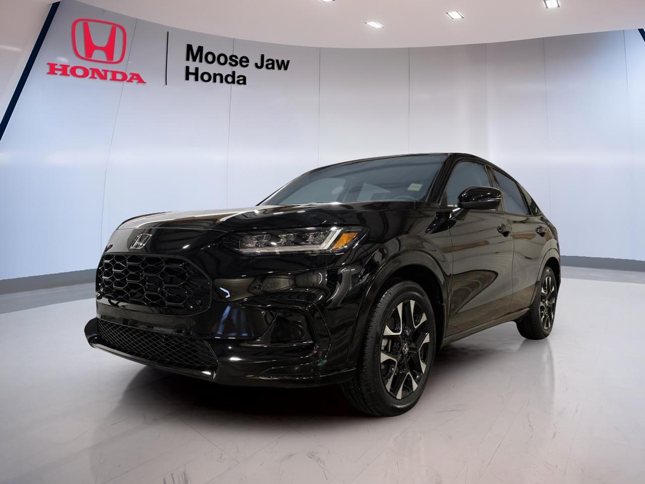 Meet the brand new 2026 Honda HR-V Ex-L at Moose Jaw Honda, right here in Moose Jaw. Finished in Black with a Black interior, this SUV is built for drivers who want a clean look, confident traction, and easy day-to-day comfort. With its 2.0 L inline 4-cylinder engine and smooth Continuously Variable Transmission (CVT), its ready for city errands, highway commutes, and weekend plans.

This 2026 Honda HR-V Ex-L keeps driving simple and steady. The 2.0 L 16-valve DOHC engine with VTEC is designed to deliver smooth power you can use every day, without fuss. Add all-wheel drive, and you get extra confidence when roads turn slick, rutted, or snow covered. Its a smart match for Saskatchewan seasons, with a calm, controlled feel that suits both new and experienced drivers.

At Moose Jaw Honda, we know many shoppers want a new SUV that feels easy to live with. This 2026 Honda HR-V Ex-L is a great fit if you value a clean cabin, a practical size, and a powertrain that focuses on smoothness. The CVT helps keep acceleration steady, especially in stop-and-go traffic, while the all-wheel drive system helps you stay composed when conditions change fast.

FEATURES OF THE HR-V Ex-L  
»» 2.0 L VTEC four-cylinder engine  
»» Continuously Variable Transmission for smooth driving  
»» All-wheel drive for four-season confidence  
»» Black exterior with Black interior  

ADVANCED SAFETY FEATURES  
»» All-wheel drive helps in low traction  
»» Predictable power delivery for confident merging  
»» Stable handling for everyday city driving  
»» Controlled response on wet or snowy roads  

PERFORMANCE AND EFFICIENCY  
»» 2.0 L inline four-cylinder performance  
»» VTEC helps balance power and control  
»» CVT supports smooth, steady acceleration  
»» All-wheel drive for confident road manners  

COMFORT AND CONVENIENCE  
»» Practical SUV height for easy entry  
»» Simple, driver-focused layout and controls  
»» Easy-to-park size for busy lots  
»» Clean Black cabin for modern feel  

TECHNONOLGY AND CONNECTIVITY  
»» Clear, easy-to-read driver information display  
»» Convenient controls placed within easy reach  
»» Modern cabin layout for daily usability  
»» Designed for simple, distraction-reduced operation  

CARGO SPACE  
»» SUV cargo area for daily gear  
»» Room for groceries, bags, and bins  
»» Flexible space for weekend errands  
»» Practical shape for easy loading  

WHAT OTHER OWNERS LIKE  
»» Confident feel from all-wheel drive  
»» Smooth operation from the CVT  
»» Practical size for city parking  
»» Easy driving position and visibility  

This 2026 Honda HR-V Ex-Ls VIN is: 3CZRZ2H71TM109122.<p> and easy day-to-day comfort. With its 2.0 L inline 4-cylinder engine and smooth Continuously Variable Transmission (CVT)</p>
<p> and weekend plans.

This 2026 Honda HR-V Ex-L keeps driving simple and steady. The 2.0 L 16-valve DOHC engine with VTEC is designed to deliver smooth power you can use every day</p>
<p> we know many shoppers want a new SUV that feels easy to live with. This 2026 Honda HR-V Ex-L is a great fit if you value a clean cabin</p>
<p> while the all-wheel drive system helps you stay composed when conditions change fast.

FEATURES OF THE HR-V Ex-L  
»» 2.0 L VTEC four-cylinder engine  
»» Continuously Variable Transmission for smooth driving  
»» All-wheel drive for four-season confidence  
»» Black exterior with Black interior  

ADVANCED SAFETY FEATURES  
»» All-wheel drive helps in low traction  
»» Predictable power delivery for confident merging  
»» Stable handling for everyday city driving  
»» Controlled response on wet or snowy roads  

PERFORMANCE AND EFFICIENCY  
»» 2.0 L inline four-cylinder performance  
»» VTEC helps balance power and control  
»» CVT supports smooth</p>
<p> steady acceleration  
»» All-wheel drive for confident road manners  

COMFORT AND CONVENIENCE  
»» Practical SUV height for easy entry  
»» Simple</p>
<p> driver-focused layout and controls  
»» Easy-to-park size for busy lots  
»» Clean Black cabin for modern feel  

TECHNONOLGY AND CONNECTIVITY  
»» Clear</p>
<p> easy-to-read driver information display  
»» Convenient controls placed within easy reach  
»» Modern cabin layout for daily usability  
»» Designed for simple</p>
<p> distraction-reduced operation  

CARGO SPACE  
»» SUV cargo area for daily gear  
»» Room for groceries</p>
<p> and bins  
»» Flexible space for weekend errands  
»» Practical shape for easy loading  

WHAT OTHER OWNERS LIKE  
»» Confident feel from all-wheel drive  
»» Smooth operation from the CVT  
»» Practical size for city parking  
»» Easy driving position and visibility  

This 2026 Honda HR-V Ex-Ls VIN is: 3CZRZ2H71TM109122.</p>