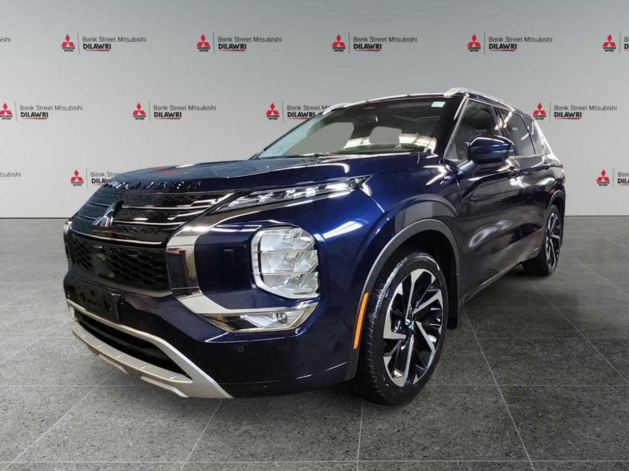 Balance of 5 year/100,000kms BASIC warranty and 10 year/160,000kms Factory Powertrain Warranty on ALL MITSUBISHI products! Best in the industry!!!! Experience the allure of the 2023 Mitsubishi Outlander GT S-AWC, offered in a stunning Blue finish that beautifully complements its 4×4 drivetrain and precise handling. This SUV is a perfect blend of style and capability. The exterior is enhanced by sleek alloy wheels and a sunroof/moonroof that adds a touch of luxury. Inside, enjoy the comfort of heated seats and power-adjustable options that cater to your every need. Keyless entry and push-button start offer convenience, while ample cargo space ensures you can carry everything you need with ease. Stay connected and entertained with a cutting-edge navigation system and an advanced heads-up display that keeps crucial information within your line of sight. Safety is a priority with features like a backup camera, lane assist, and parking sensors, ensuring that every journey is as safe as possible. Additionally, smart device integration and satellite radio keep you connected and entertained. This Outlander is ideal for families and adventurers looking for a reliable yet elegant SUV. Contact us today to learn more about how the 2023 Mitsubishi Outlander GT S-AWC can elevate your driving experience.