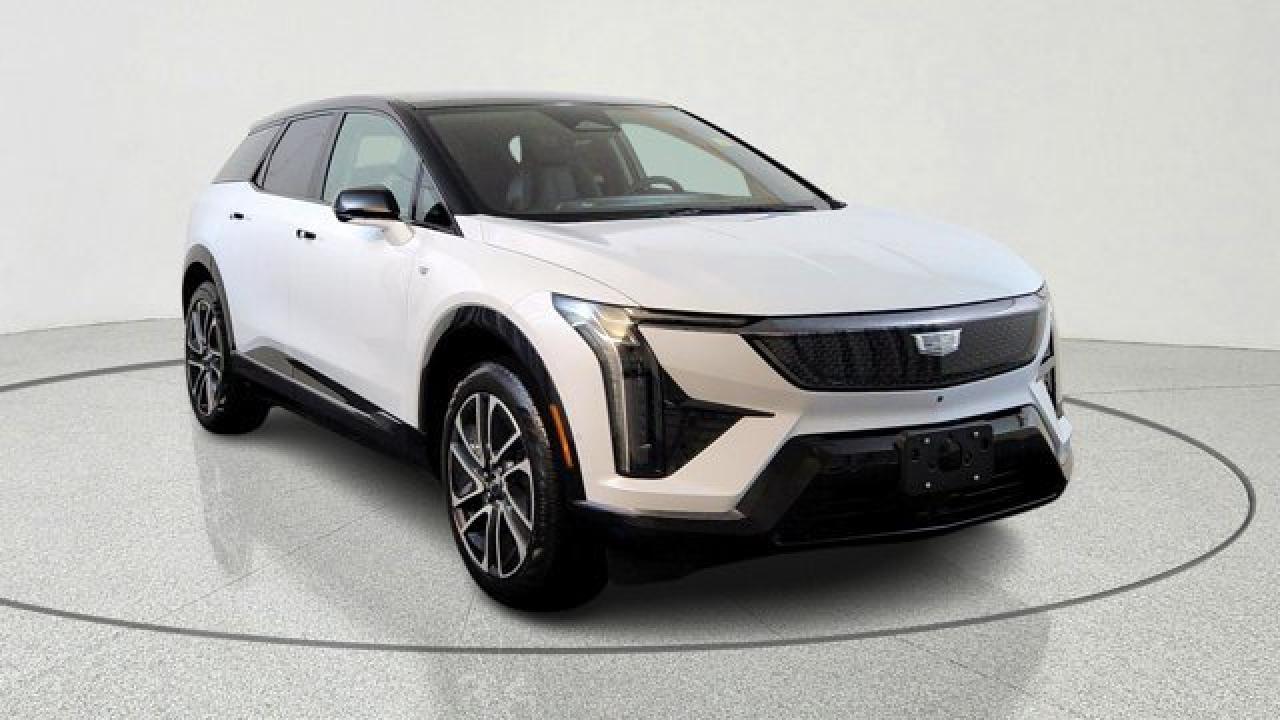 The 2026 Cadillac OPTIQ Premium Sport combines sporty aesthetics with premium comfort, offering a refined electric SUV experience. It comes standard with ventilated and lumbar-massaging front seats, heated rear outboard seats, and 8-way power front passenger seating with memory. On the tech and styling front, it features choreographed LED lighting (including head- and tail-lamps), a contrasting paing colour on the roof, a heads-up display, rear cargo cover, and 20-inch dark-android wheels paired with low-profile tires.