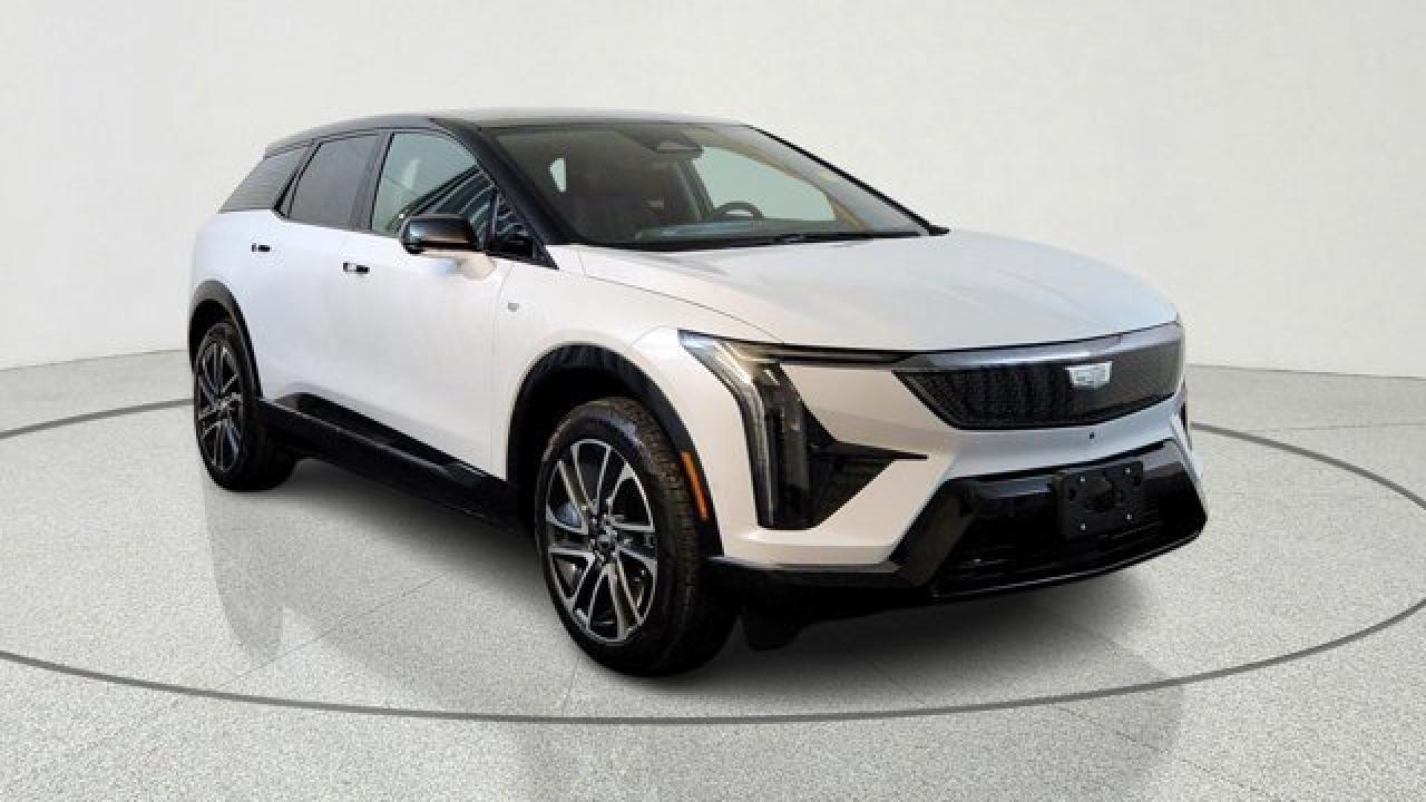 The all-electric 2026 Cadillac OPTIQ Premium Sport combines sporty aesthetics with premium comfort, offering a refined electric SUV experience. It comes standard with ventilated and lumbar-massaging front seats, heated rear outboard seats, and 8-way power front passenger seating with memory. On the tech and styling front, it features choreographed LED lighting (including head- and tail-lamps), a contrasting colour on the roof, a heads-up display, rear cargo cover, and 20-inch dark-android wheels paired with low-profile tires.