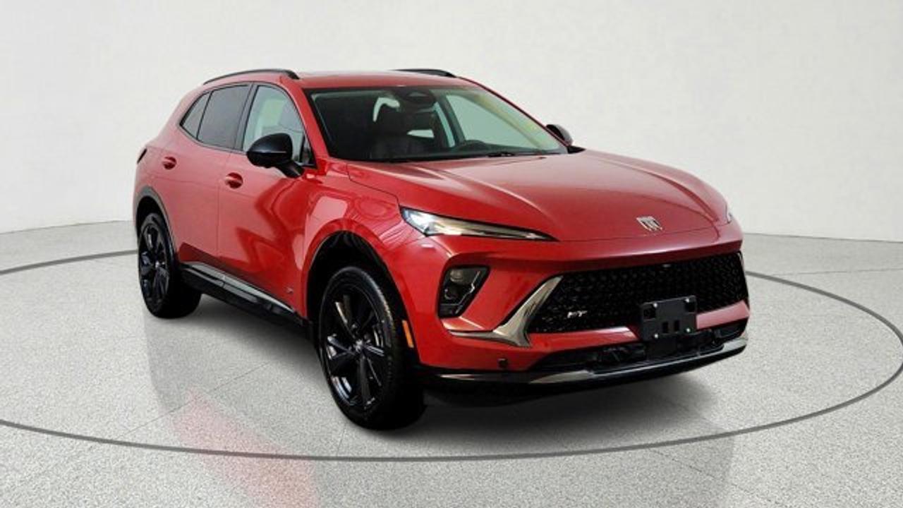 The 2026 Buick Envision Sport Touring delivers athletic styling and premium amenities. Its powered by a 2.0-liter turbocharged 4-cylinder engine paired with a 9-speed automatic transmission and standard all-wheel drive, riding on 20-inch alloy wheels with dark-gloss accents for a more aggressive look. Inside, the cabin features a large 30-inch ultrawide display, heated front seats, a Bose premium sound system, adaptive cruise control, lane-keeping assistance, and a panoramic power moonroof that brings in extra light and openness.