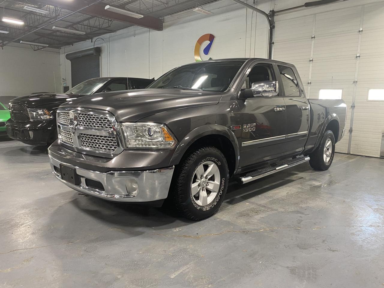 2016 RAM 1500 4WD Quad Cab 140.5" Laramie - Photo #1