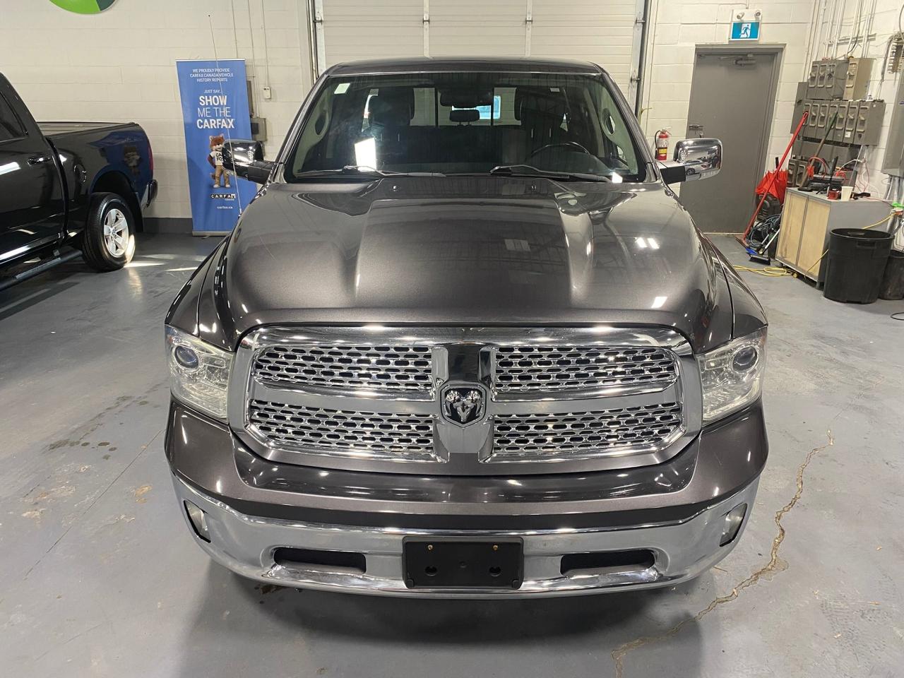 2016 RAM 1500 4WD Quad Cab 140.5" Laramie Photo