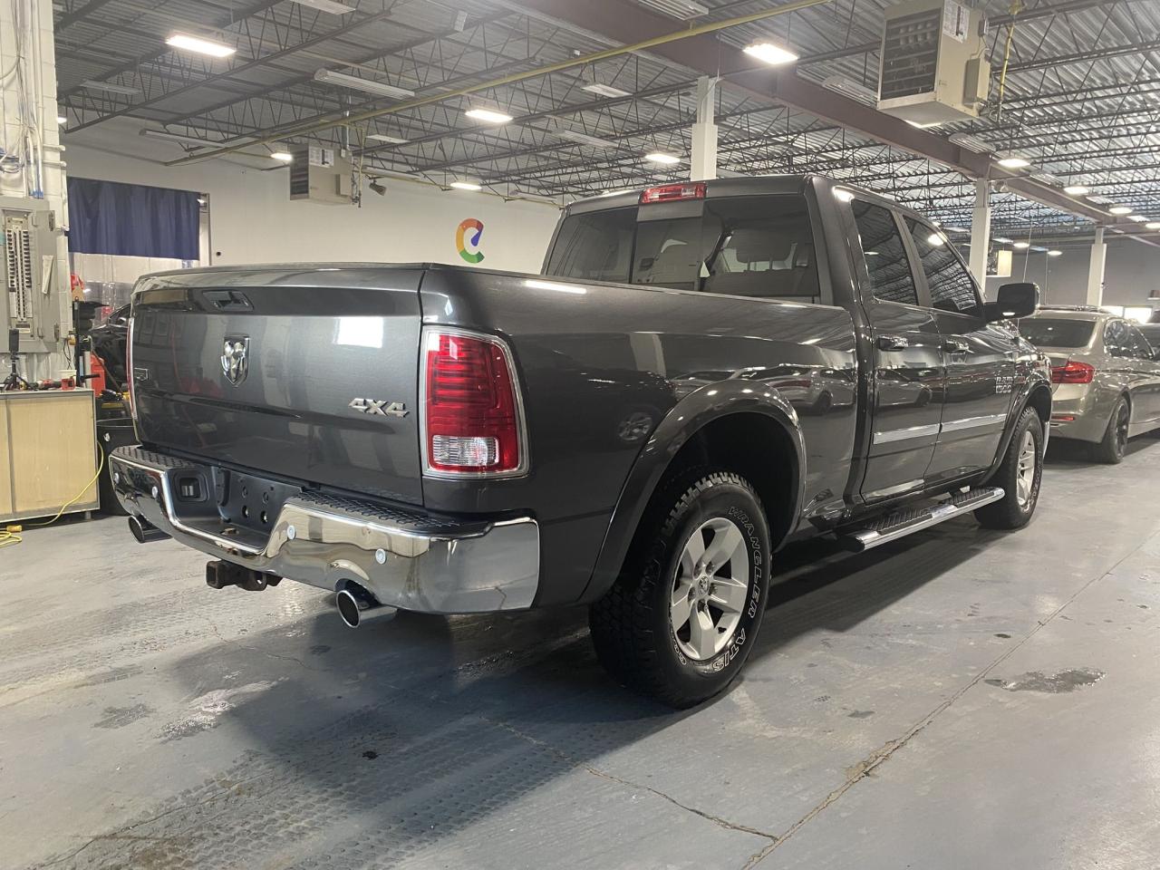 2016 RAM 1500 4WD Quad Cab 140.5" Laramie Photo