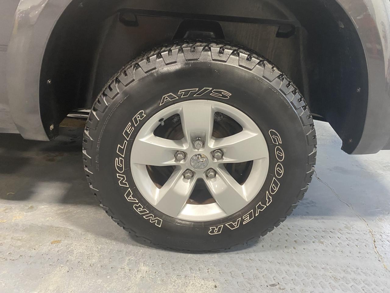 2016 RAM 1500 4WD Quad Cab 140.5" Laramie Photo