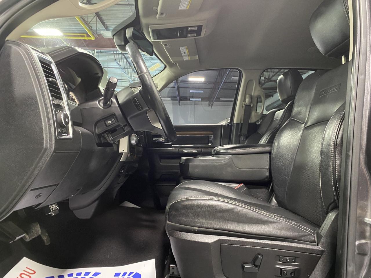 2016 RAM 1500 4WD Quad Cab 140.5" Laramie Photo