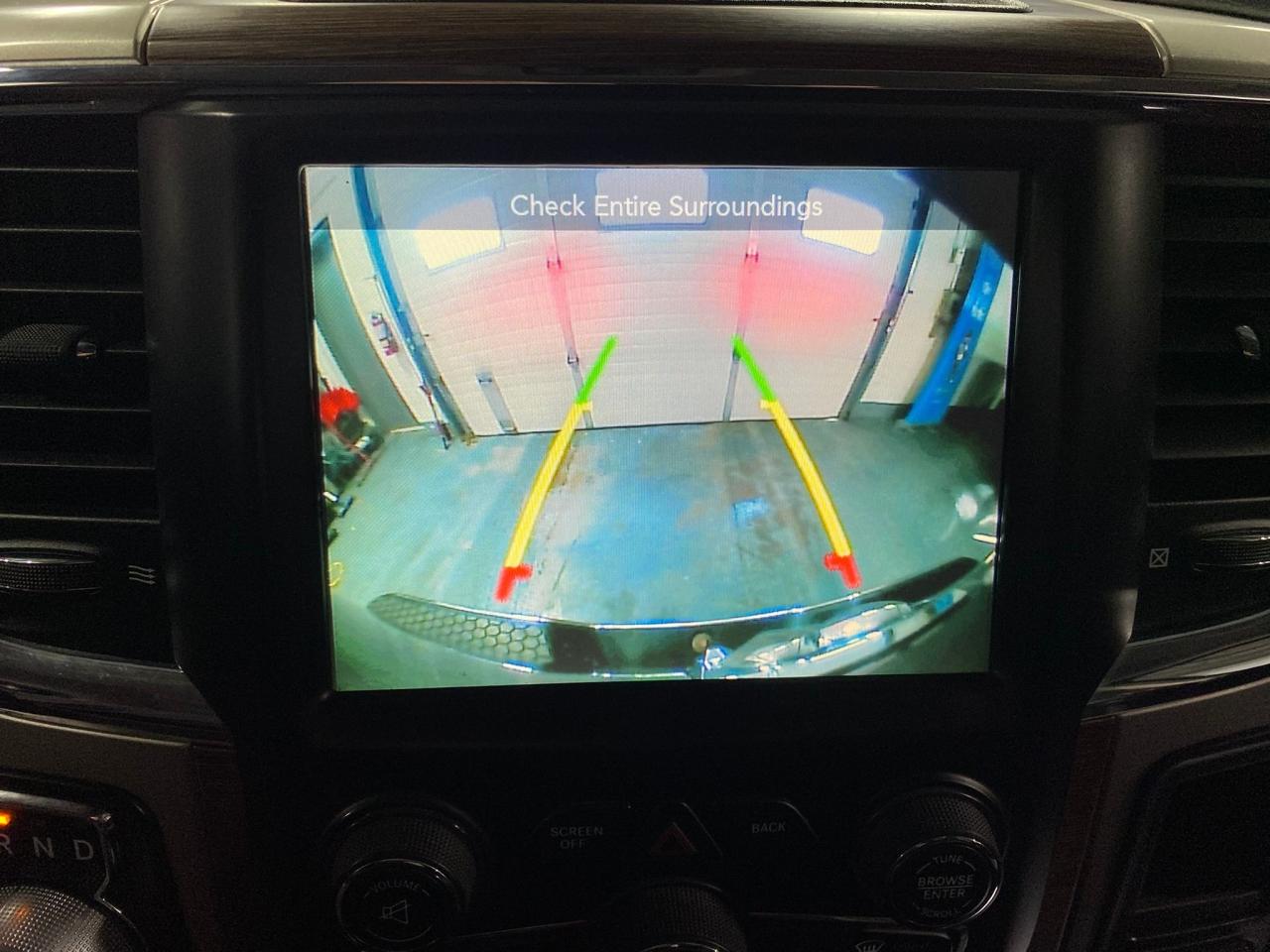 2016 RAM 1500 4WD Quad Cab 140.5" Laramie Photo