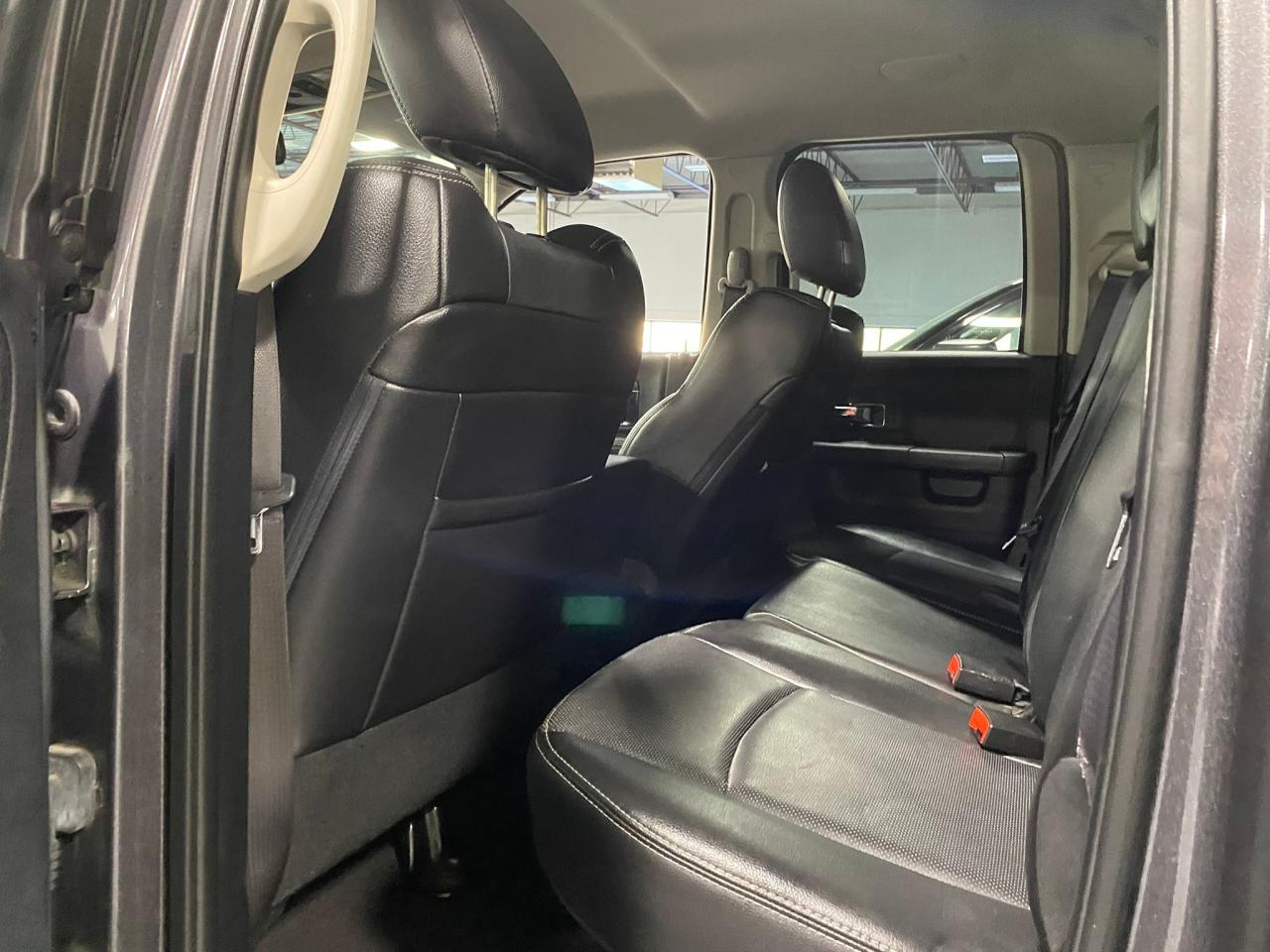 2016 RAM 1500 4WD Quad Cab 140.5" Laramie Photo