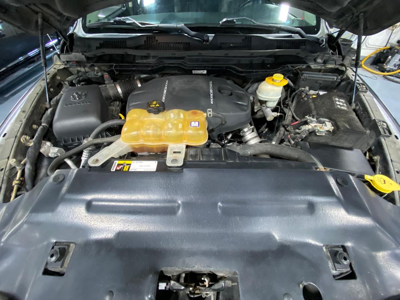 2016 RAM 1500 4WD Quad Cab 140.5" Laramie Photo