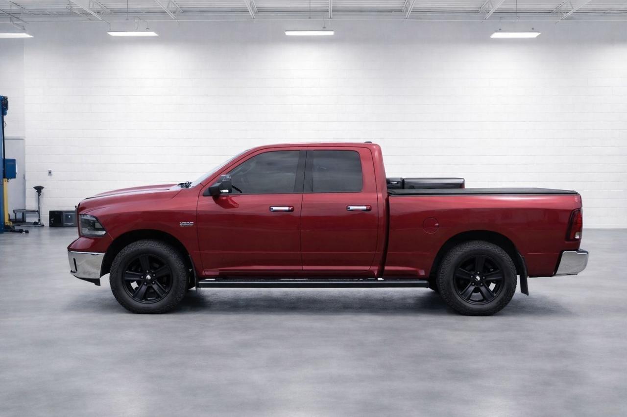 2013 RAM 1500 4WD Quad Cab 140.5" Photo