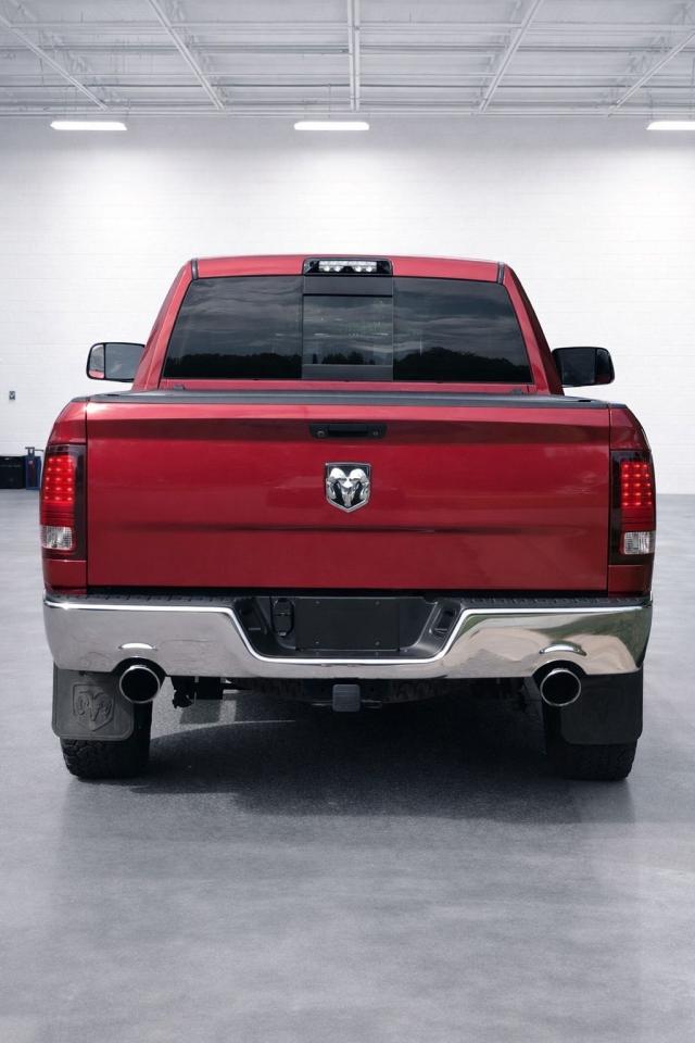 2013 RAM 1500 4WD Quad Cab 140.5" Photo