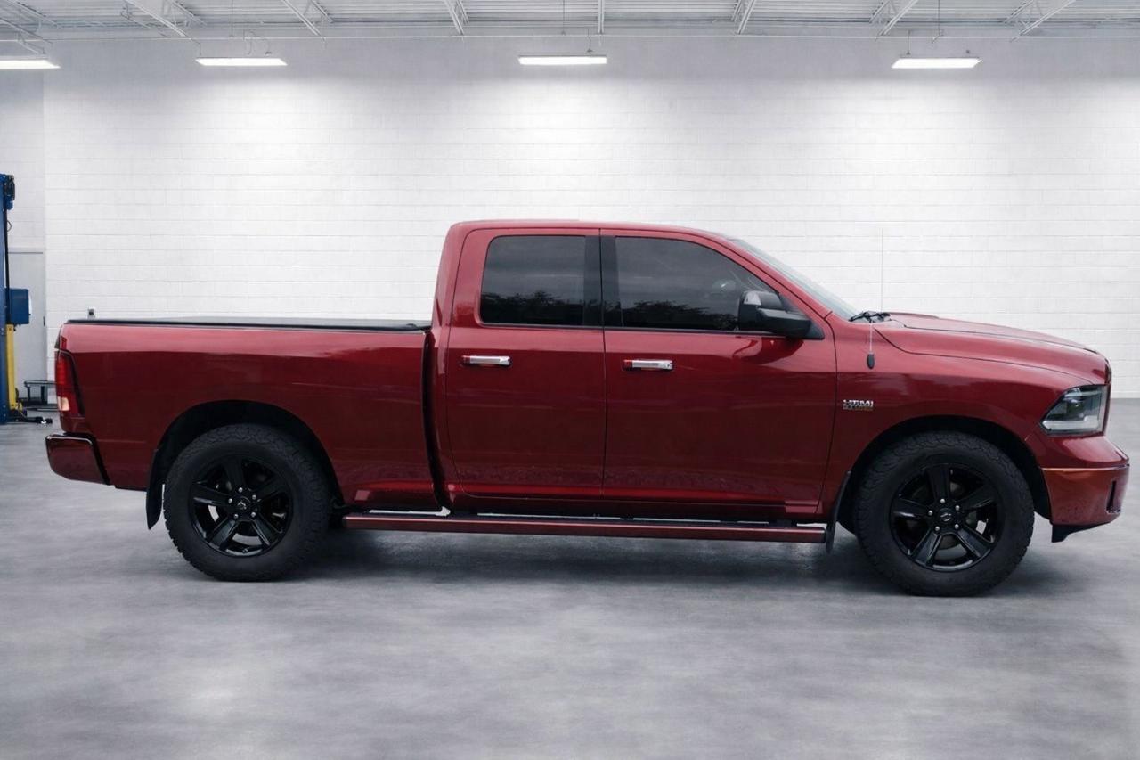 2013 RAM 1500 4WD Quad Cab 140.5" Photo