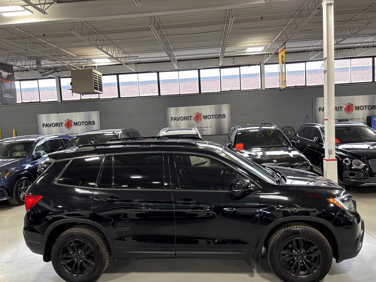2019 Honda Passport Touring AWD|V6|NAV|LEATHER|SUNROOF|ECOMODE|SAFETEC Photo2