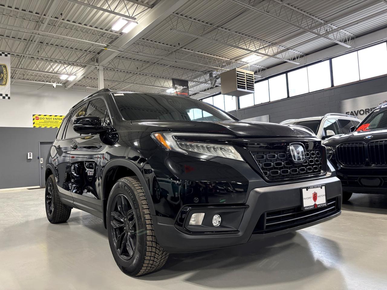 2019 Honda Passport Touring AWD|V6|NAV|LEATHER|SUNROOF|ECOMODE|SAFETEC Photo