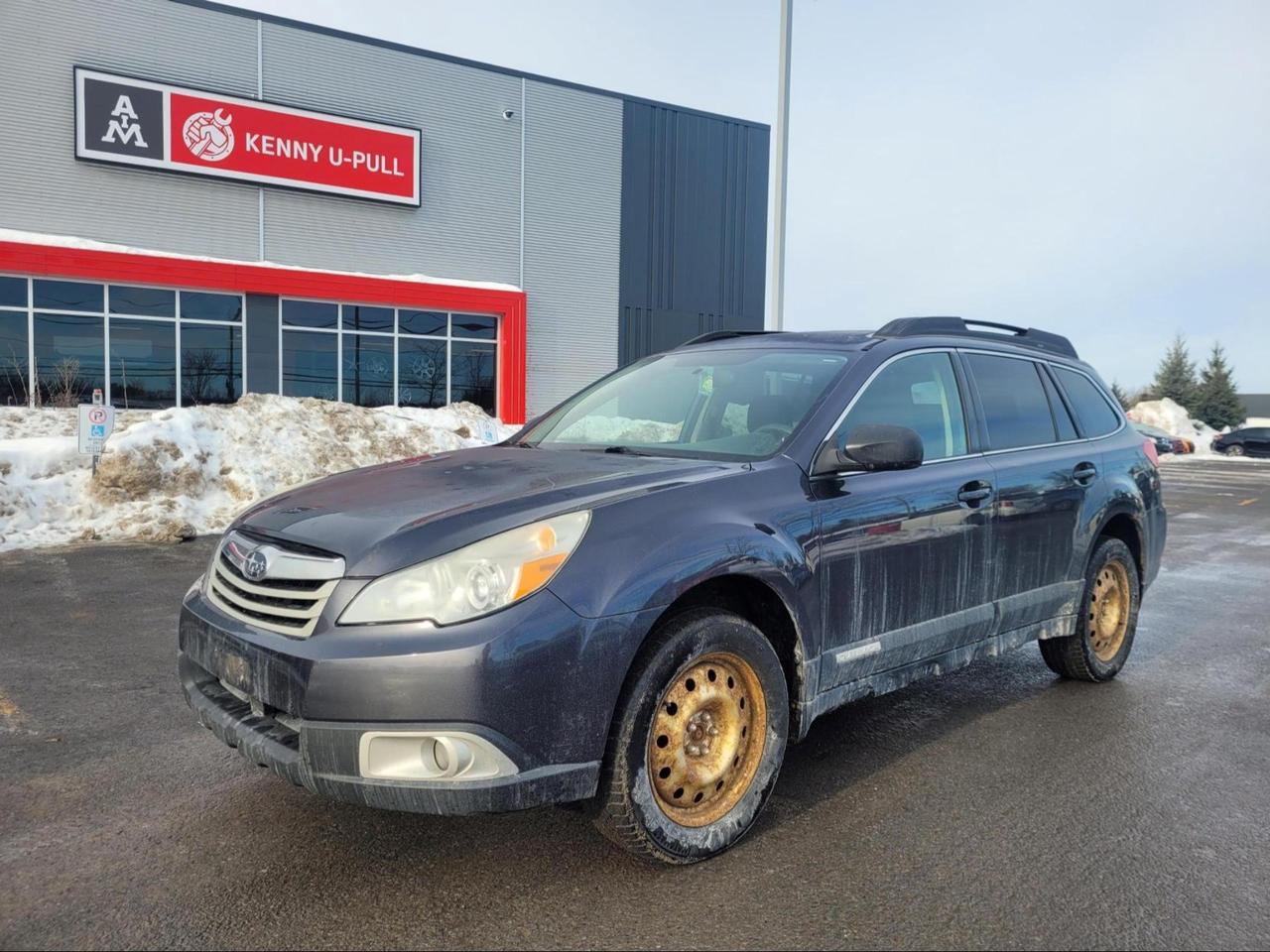 2012 Subaru Outback in Graphite Grey Metallic . The vehicle has 290,279km. The vehicle runs and drives ok. The body is in ok shape. There is check engine TC light on . Might need a new battery. Slight vibrations felt from the engine bay/inside the cabin. Exhaust Leak. We dont perform any mechanical/safety inspections. The vehicle is sold as is and might need some work.