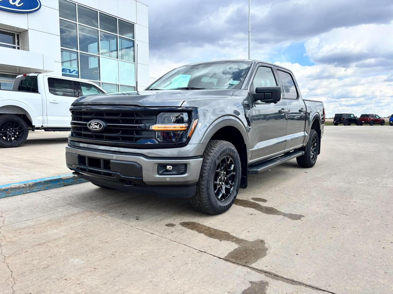 <p>Looking for a powerful and versatile pickup thats ready for anything? Feast your eyes on the all-new 2026 Ford F-150 XLT 4WD SuperCrew at Webbs 14 41 Ford! This truck is built to handle both your daily commute and your weekend adventures. Sporting a sleek Carbonized Grey Metallic exterior, this F-150 is as stylish as it is capable. The XLT trim ensures youll enjoy a comfortable and well-equipped interior, ready for any journey.</p><p>This F-150 doesnt just look good, its packed with features designed to enhance your driving experience. Under the hood, youll find a potent 2.7L V6 EcoBoost engine paired with a smooth-shifting electronic 10-speed automatic transmission. Whether youre hauling cargo, hitting the trails, or simply cruising down the highway, this truck offers the performance and capability you need. With its 4-wheel drive system, youll have the confidence to tackle any terrain.</p><p>Here are five stand-out features of this impressive pickup:</p><ul><li><strong>FX4 Off-Road Package:</strong> Ready to conquer any terrain with enhanced off-road capabilities.</li><li><strong>BlueCruise:</strong> Experience the future of driving with hands-free highway driving.</li><li><strong>XLT Black Appearance Package:</strong> Makes this truck head-turning and stylish.</li><li><strong>Integrated Trailer Brake Controller:</strong> Get ready to tow with confidence.</li><li><strong>Bed Utility Package:</strong> This truck is ready for work or play!</li></ul><p><strong><em>Powered by AutoIntelligence&trade;</em></strong> Powered by AutoIntelligence&trade;</p>