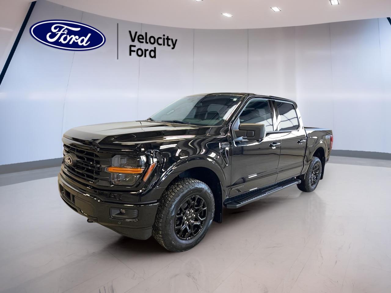 Meet the brand new 2026 Ford F-150 Hybrid XLT SuperCrew Powerboost, now at Velocity Ford in Moose Jaw. This full-size hybrid truck blends real work-ready strength with smart fuel-saving tech, giving you confident power for towing, commuting, and weekends away. Finished in Black outside with a Black interior, it brings a clean, modern look that suits job sites and driveways alike.

With four full doors and a roomy SuperCrew cabin, the 2026 Ford F-150 Hybrid XLT SuperCrew Powerboost is built for people who need space without giving up capability. The 3.5-litre hybrid powertrain works with an automatic transmission for smooth response in traffic and steady pull when the load gets heavy. Add in Four-Wheel Drive, and youre ready for changing road conditions across Saskatchewan.

TRUCK FEATURES  
»» Towing capacity rated at 4,671 kg  
»» Four-Wheel Drive for confident traction  
»» Rear tow hook for recovery support  
»» Off-road tires for rugged conditions  

HYBRID VEHICLE FEATURES  
»» 3.5-litre hybrid engine for efficiency  
»» Hybrid system supports strong low-end torque  
»» Automatic transmission for smooth power delivery  
»» Fuel-saving design for daily driving  

ADVANCED SAFETY FEATURES  
»» Anti-Lock Braking System for controlled stops  
»» Stability Control helps maintain vehicle balance  
»» Blind Spot Monitor for safer lane changes  
»» Lane Departure Warning adds extra awareness  

PERFORMANCE AND EFFICIENCY  
»» 3.5-litre hybrid power for hauling  
»» Automatic transmission with dual shift mode  
»» Power Steering for easy low-speed handling  
»» Four-Wheel Drive for all-season capability  

COMFORT AND CONVENIENCE  
»» Front air conditioning for cabin comfort  
»» Power windows for quick ventilation  
»» Cruise Control helps reduce driver fatigue  
»» Driver lumbar support for longer drives  

TECHNONOLGY AND CONNECTIVITY  
»» Bluetooth Integration for hands-free calling  
»» Steering wheel audio controls within reach  
»» WiFi hotspot helps keep devices connected  
»» Satellite radio for more listening choice  

CARGO SPACE  
»» Rear trunk access for easier loading  
»» Spare tire onboard for peace of mind  
»» Tinted windows help protect stored items  
»» SuperCrew cabin adds in-cab storage  

WHAT OTHER OWNERS LIKE  
»» Confident towing and everyday drivability balance  
»» Helpful driver-assist features for busy roads  
»» Strong traction feel from Four-Wheel Drive  
»» Easy connectivity through Bluetooth and WiFi  

At Velocity Ford in Moose Jaw, this brand new 2026 Ford F-150 Hybrid XLT SuperCrew Pwerboost is ready to deliver the hybrid advantage you want, with the towing muscle you need. From highway merges to winter streets, its a smart pick for drivers who want a capable truck that also thinks about fuel use.

This 2026 Ford F-150 Hybrid XLT SuperCrew Pwerboosts VIN is: 1FTFW3LD0TFA23918.