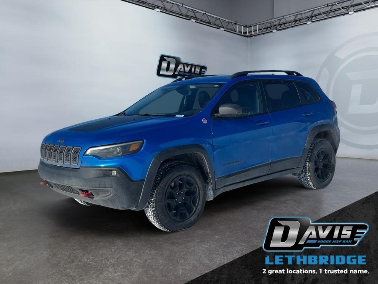 <b>Off-Road Suspension, Apple CarPlay, Android Auto, Heated Mirrors!</b><br /> <br /> Aiming to be more than another run-of-the-mill crossover, this 2019 Cherokee brings a measure of ruggedness to the party in the way that only a Jeep can, says Car and Driver. This 2019 Jeep Cherokee is fresh on our lot in Lethbridge. <br /> <br />When the freedom to explore arrives alongside exceptional value, the world opens up to offer endless opportunities. This is what you can expect with this Jeep Cherokee. With an exceptionally smooth ride and an award-winning interior, this Cherokee can take you anywhere in comfort and style. Redesigned for 2019, this Jeep has a refined new look without sacrificing its rugged presence. Experience adventure and discover new territories with the unique and authentically crafted Jeep Cherokee, a major player in Canada's best-selling SUV brand. This SUV has 133,848 km. Stock number 41167 is Blue in colour. It has an Automatic transmission and is powered by a 271HP 3.2L V6 Cylinder Engine. <br /> <br /> Our Cherokee's trim level is Trailhawk. Travel in style with this off-road-ready Jeep Cherokee Trailhawk. It comes loaded with heated leather seats with red stitching, driver memory settings, a heated steering wheel, unique black aluminum wheels, 4-wheel drive, an off-road suspension, skid plates, hands free liftgate, Uconnect 8.4 with Bluetooth, a rearview camera and much more. This vehicle has been upgraded with the following features: Off-Road Suspension, Apple CarPlay, Android Auto, Heated Mirrors.<br /> <br />To apply right now for financing use this link: <a href=https://lethbridge.davisdodge.ca/free-credit-check/ target=_blank rel=nofollow noopener noreferrer>https://lethbridge.davisdodge.ca/free-credit-check/</a><br /><br /> <br /><br />Locally Owned & Trusted for Over 35 Years  Davis Dodge in Lethbridge, AB <br /><br /> At Davis Dodge, weve proudly served the Lethbridge community for more than 35 years, offering an unparalleled car buying experience. Dont just take our word for itour Google reviews speak volumes about our commitment to exceptional service. <br /><br /> Delivery & At-Home Test Drives: Convenient options to suit your lifestyle. <br /><br /> Flexible Financing for Everyone: Get the vehicle you need with financing solutions tailored to your situation. <br /><br /> Full Mechanical Inspections & Professional Cleaning: Every vehicle is thoroughly inspected and cleaned before it hits our lot.<br /><br /> We take all makes and models on trade and offer competitive pricing with inventory that changes daily. Whether you're shopping for a Chrysler, Dodge, Jeep, RAM, or FIAT, our AMVIC Licensed dealership makes it easy to browse, buy, and drive away.<br /><br /> Located in Lethbridge, AB, we proudly serve customers in Fort Macleod, Taber, Claresholm, and Coaldale. Shop online or visit us today to experience the best in sales, service, and selection. Standard bank rates apply; taxes are additional.<br /><br /> Vehicle pricing offer shown expires 2026-02-28. <br /> Come by and check out our fleet of 60+ used cars and trucks and 120+ new cars and trucks for sale in Lethbridge. o~o