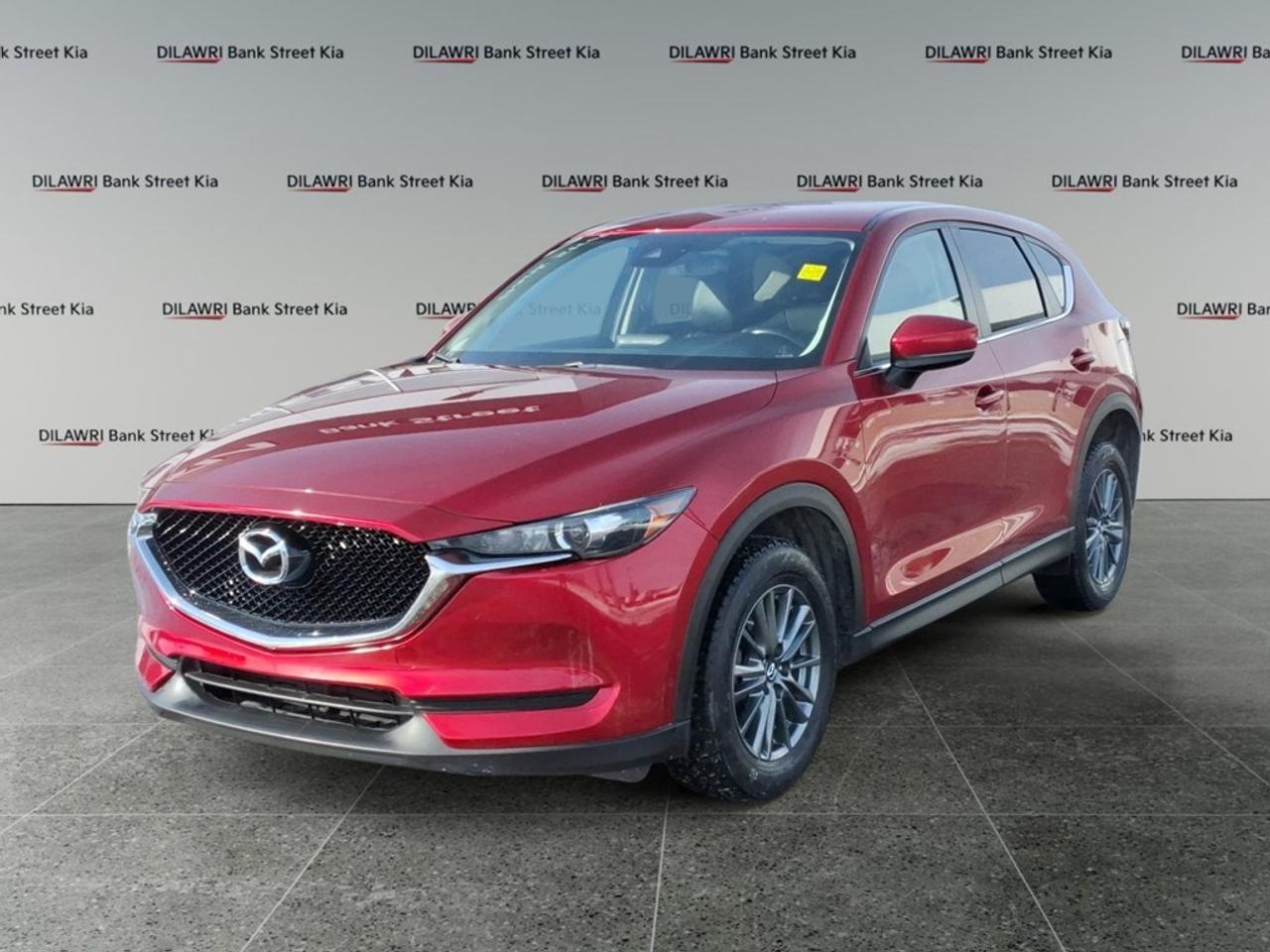 *** CASH PURCHASE PRICE $20900*** PLUS HST The 2018 Mazda CX-5 GS in striking Red with its AWD drive train ensures confident handling on any terrain. This sporty SUV not only promises style but also delivers advanced features, making every journey a pleasure. Step inside and youre welcomed by a thoughtfully designed interior boasting heated front seats and a leather steering wheel to enhance your comfort. Exterior features include heated mirrors and alloy wheels, highlighting the perfect blend of form and function. Advanced technology integrates seamlessly with your lifestyle, offering options such as a backup camera and lane assist for added safety. A touchscreen interface with smart device integration ensures you stay connected, while Bluetooth capability enhances your driving experience. This Mazda CX-5 GS appeals to those seeking both performance and comfort. If youre searching for an SUV that provides reliability without sacrificing luxury, this is the perfect choice for you. Contact us today for more information and make the 2018 Mazda CX-5 your own.
