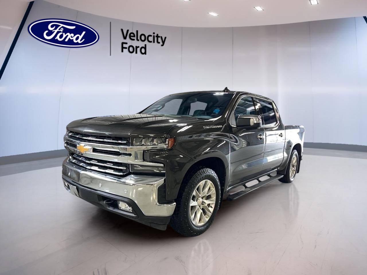 Meet the 2021 Chevrolet Silverado 1500 LTZ Crew Cab, now available used at Velocity Ford in Moose Jaw. Finished in brown with a dark grey interior, this full-size truck is built for real work and everyday comfort. With 202,899 km, its ready for its next chapter.

Under the hood, this 2021 Chevrolet Silverado 1500 LTZ Crew Cab uses a 5.3 L gas engine paired with an 8-speed automatic transmission. Add in Four-Wheel Drive (4WD), and you have confident traction for winter roads, gravel lanes, and jobsite conditions. With 4 doors and a spacious crew cab layout, it also fits family life with ease.

TRUCK FEATURES  
»» Towing capacity rated up to 5,397 kg  
»» Four-Wheel Drive for tough conditions  
»» Rear tow hook for recovery help  
»» Limited slip differential improves traction  

ADVANCED SAFETY FEATURES  
»» Anti-Lock Braking System for control  
»» Stability Control helps in slippery turns  
»» Side impact airbags for added protection  
»» Backup camera for easier reversing  

PERFORMANCE AND EFFICIENCY  
»» 5.3 L gas V8 power delivery  
»» 8-speed automatic for smooth shifting  
»» Power steering for easy low-speed turns  
»» Four-Wheel Drive for confident grip  

COMFORT AND CONVENIENCE  
»» Dual-zone automatic climate control comfort  
»» Heated front seats for cold mornings  
»» Heated rear seats for passengers  
»» Remote starter for quick warmups  

TECHNONOLGY AND CONNECTIVITY  
»» Bluetooth integration for hands-free calling  
»» Steering wheel audio controls included  
»» Satellite radio and HD Radio  
»» WiFi hotspot for connected travel  

CARGO SPACE  
»» Crew cab keeps gear secure  
»» Power outlet for tools and devices  
»» Tinted windows add cabin privacy  
»» Power windows for quick ventilation  

WHAT OTHER OWNERS LIKE  
»» Strong towing and everyday hauling ability  
»» Confident feel from Four-Wheel Drive  
»» Comfortable cabin with useful storage  
»» Easy tech like Bluetooth connectivity  

This 2021 Chevrolet Silverado 1500 LTZ Crew Cab includes practical features that make daily driving simpler, like push button start, automatic door locks, and a rear window defroster. You also get heated mirrors, power mirrors, and retractable mirrors to help with visibility in changing weather.

For longer drives, cruise control helps reduce fatigue, while the auto-dimming rearview mirror cuts glare at night. The driver-focused layout adds memory seats, memory mirrors, a drivers side power seat, and power passenger seating, plus lumbar support for both front occupants. Tire Pressure Monitoring and a Blind Spot Monitor add extra confidence on busy roads.

This 2021 Chevrolet Silverado 1500 LTZ Crew Cabs VIN is: 3GCUYGED3MG343773.