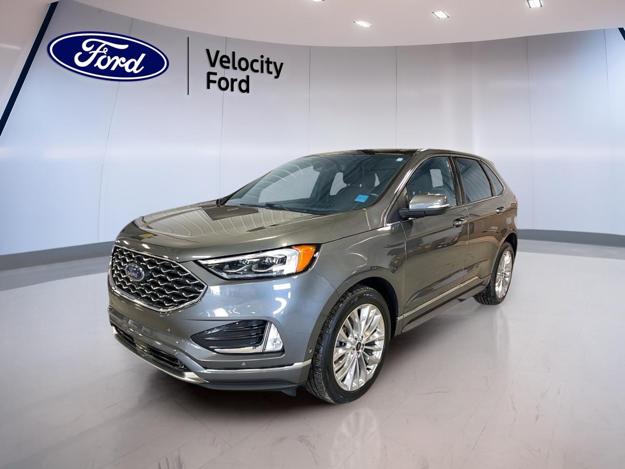 Meet the 2022 Ford Edge Titanium AWD, now available used at Velocity Ford in Moose Jaw. Finished in grey with a black interior, this 4-door SUV blends a clean look with everyday ease. With 68,722 km, a 2.0 L gas engine, and an automatic transmission, its ready for workdays, weekends, and winter roads.

The 2022 Ford Edge Titanium AWD is built for drivers who want a premium feel without the stress. You get smart comfort features for cold mornings, helpful driver-assist tech for busy streets, and a confident all-wheel-drive setup for changing Saskatchewan weather. Its a great fit for commuting, family errands, and road trips alike.

FEATURES OF THE Edge Titanium AWD
»» All-wheel drive for confident traction  
»» Power liftgate for easier loading  
»» Heated front seats for cold days  
»» Memory mirrors for quick adjustments  

ADVANCED SAFETY FEATURES
»» Anti-lock braking system for controlled stops  
»» Stability control helps maintain steady handling  
»» Blind spot monitor aids safer lane changes  
»» Lane departure warning alerts drifting  

PERFORMANCE AND EFFICIENCY
»» 2.0 L gas engine for balance  
»» 8-speed automatic transmission shifts smoothly  
»» Power steering for easy low-speed turns  
»» Limited slip differential improves traction grip  

COMFORT AND CONVENIENCE
»» Dual-zone automatic climate control for comfort  
»» Remote starter helps warm up quickly  
»» Power windows for all passengers  
»» Driver lumbar support for longer drives  

TECHNONOLGY AND CONNECTIVITY
»» Bluetooth integration for hands-free calling  
»» WiFi hotspot keeps devices connected  
»» Satellite radio adds more listening choice  
»» Steering wheel audio controls within easy reach  

CARGO SPACE
»» Power liftgate for quick rear access  
»» Remote trunk release from key fob  
»» Rear trunk access for daily flexibility  
»» Spare tire included for added reassurance  

WHAT OTHER OWNERS LIKE
»» Confident feel from all-wheel drive  
»» Helpful safety alerts in busy traffic  
»» Comfortable cabin for longer commutes  
»» Easy loading with power liftgate  

This 2022 Ford Edge Titanium AWDs VIN is: 2FMPK4K9XNBB08378.