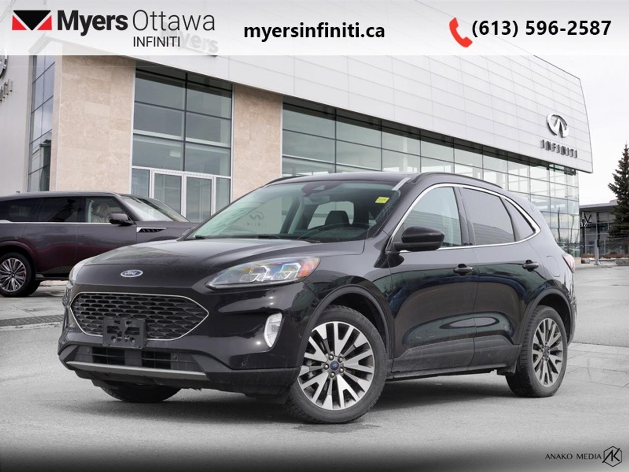 <b>Heated Seats!</b><br> <br>  Compare at $23864 - Our Price is just $23169! <br> <br>With an interior that easily adapts to your needs and keeps all your equipment hidden, the Ford Escape is the perfect partner for the spontaneous adventurer. This 2021 Ford Escape is fresh on our lot in Ottawa. <br> <br>The Ford Escape was built for an active lifestyle and offers plenty of options for you to hit the road in your own individual style. Whether you need a family SUV for soccer practice, a capable adventure vehicle, or both, the versatile Ford Escape has you covered. Built for those who live on the go, the Ford Escape was made to be unstoppable. This SUV has 85,503 km. Its Agate Black Metallic in colour and is completely accident free based on the <a href=https://vhr.carfax.ca/?id=5WGItaSXQucsVyOU8L2fi1YUlveRc0bO target=_blank>CARFAX Report</a>. It has an Automatic transmission and is powered by a 200HP 2.5L 4 Cylinder Engine. It may have some remaining factory warranty, please check with dealer for details. <br> <br> Our Escapes trim level is Titanium Hybrid AWD. Stepping up to this premium Ford Escape Titanium Hybrid is a great choice as it comes fully loaded with heated sport contour premium seats that are powered in the front, exclusive aluminum wheels and Fords SYNC 3 infotainment system complete with a large touchscreen, integrated navigation, Apple CarPlay and Android Auto. Additional features include a power rear liftgate, heated leatherette steering wheel, SiriusXM radio paired with a premium Bang and Olufsen audio system, FordPass Connect 4G LTE, automatic climate control, a smart device remote starter plus unique exterior accents. For added convenience and safety this Ford Escape also comes with active park assist, Ford Co-Pilot360 that features lane keep assist, active park assist, blind spot detection, automatic emergency braking with evasion assist and cross traffic alert plus much more. This vehicle has been upgraded with the following features: Heated Seats.<br> To view the original window sticker for this vehicle view this <a href=http://www.windowsticker.forddirect.com/windowsticker.pdf?vin=1FMCU9DZ2MUA79728 target=_blank>http://www.windowsticker.forddirect.com/windowsticker.pdf?vin=1FMCU9DZ2MUA79728</a>. <br/><br> <br>To apply right now for financing use this link: <a href=https://www.myersinfiniti.ca/finance/ target=_blank>https://www.myersinfiniti.ca/finance/</a><br><br> <br/><br> Buy this vehicle now for the lowest bi-weekly payment of <b>$217.42</b> with $0 down for 72 months @ 8.99% APR O.A.C. ( taxes included, and licensing fees   ).  See dealer for details. <br> <br>*LIFETIME ENGINE TRANSMISSION WARRANTY NOT AVAILABLE ON VEHICLES WITH KMS EXCEEDING 140,000KM, VEHICLES 8 YEARS & OLDER, OR HIGHLINE BRAND VEHICLE(eg. BMW, INFINITI. CADILLAC, LEXUS...)<br> Come by and check out our fleet of 50+ used cars and trucks and 120+ new cars and trucks for sale in Ottawa.  o~o